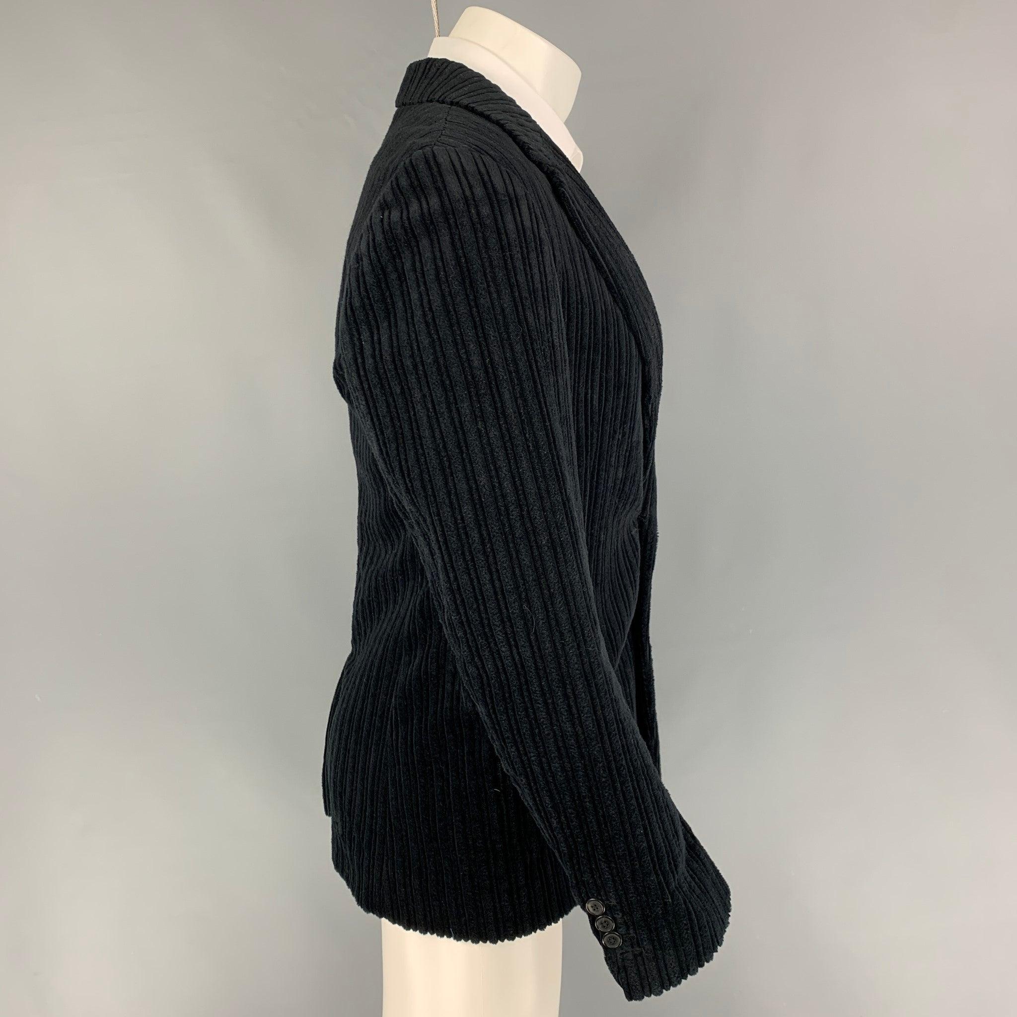 DRIES VAN NOTEN sport coat comes in a black textured velvet cotton with a full liner featuring a notch lapel, flap pockets, single back vent, and a double button closure.
Very Good
Pre-Owned Condition. 

Marked:   46 

Measurements: 
 
Shoulder: