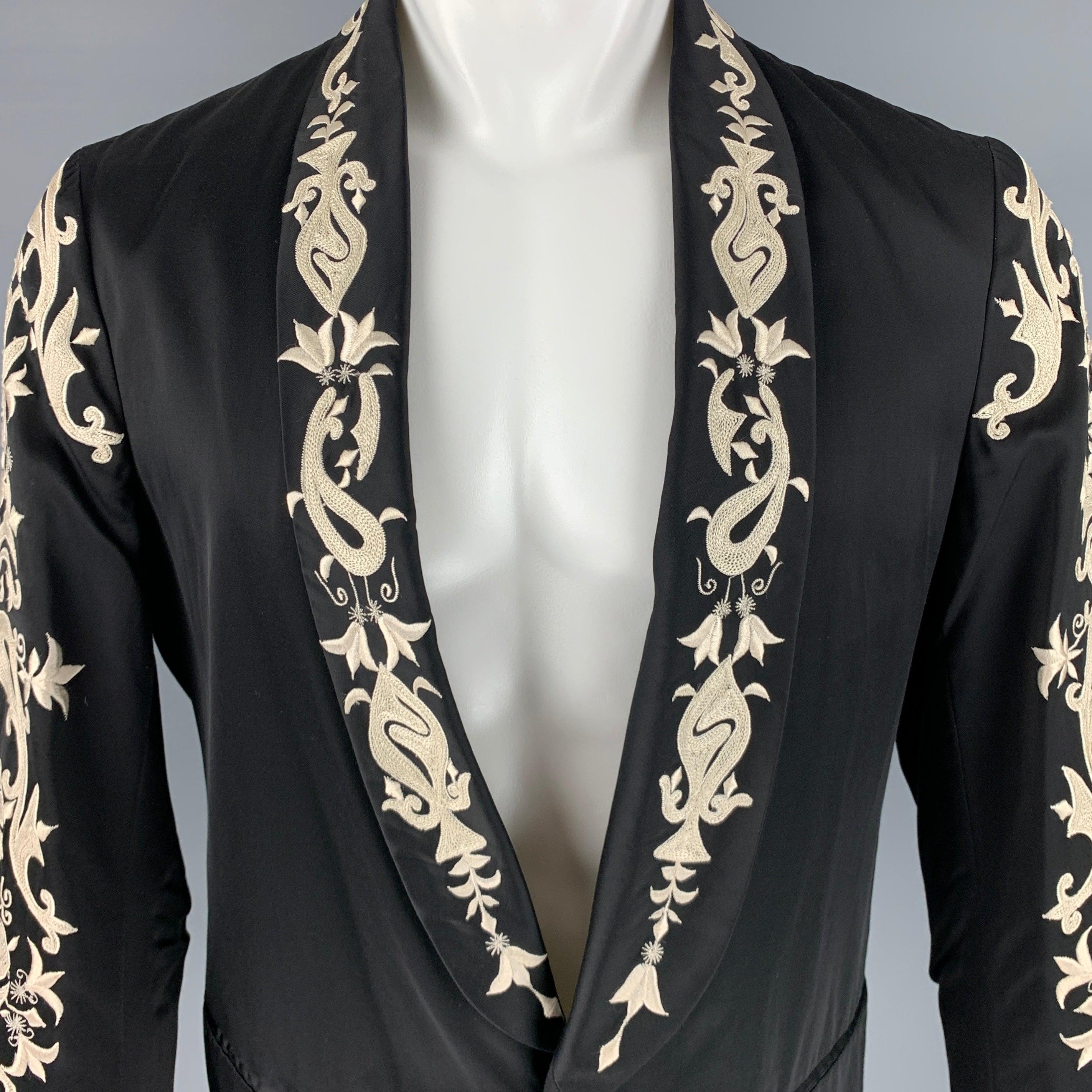 DRIES VAN NOTEN sport coat
in a black viscose cotton blend fabric featuring cream floral embroidery on lapel and sleeves, shawl collar, and single button closure. Made in Belgium.Excellent Pre-Owned Condition. 

Marked:   48 

Measurements: 
