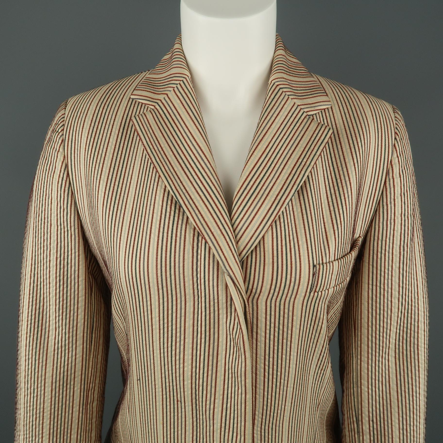 DRIES VAN NOTEN coat comes in a beige linen silk blend fabric with red and blue striped texture, hidden placket single breasted button front, notch lapel, flap pockets, and slit cuffs. Button broken. As-is.
 
Very Good Pre-Owned Condition.
Marked: