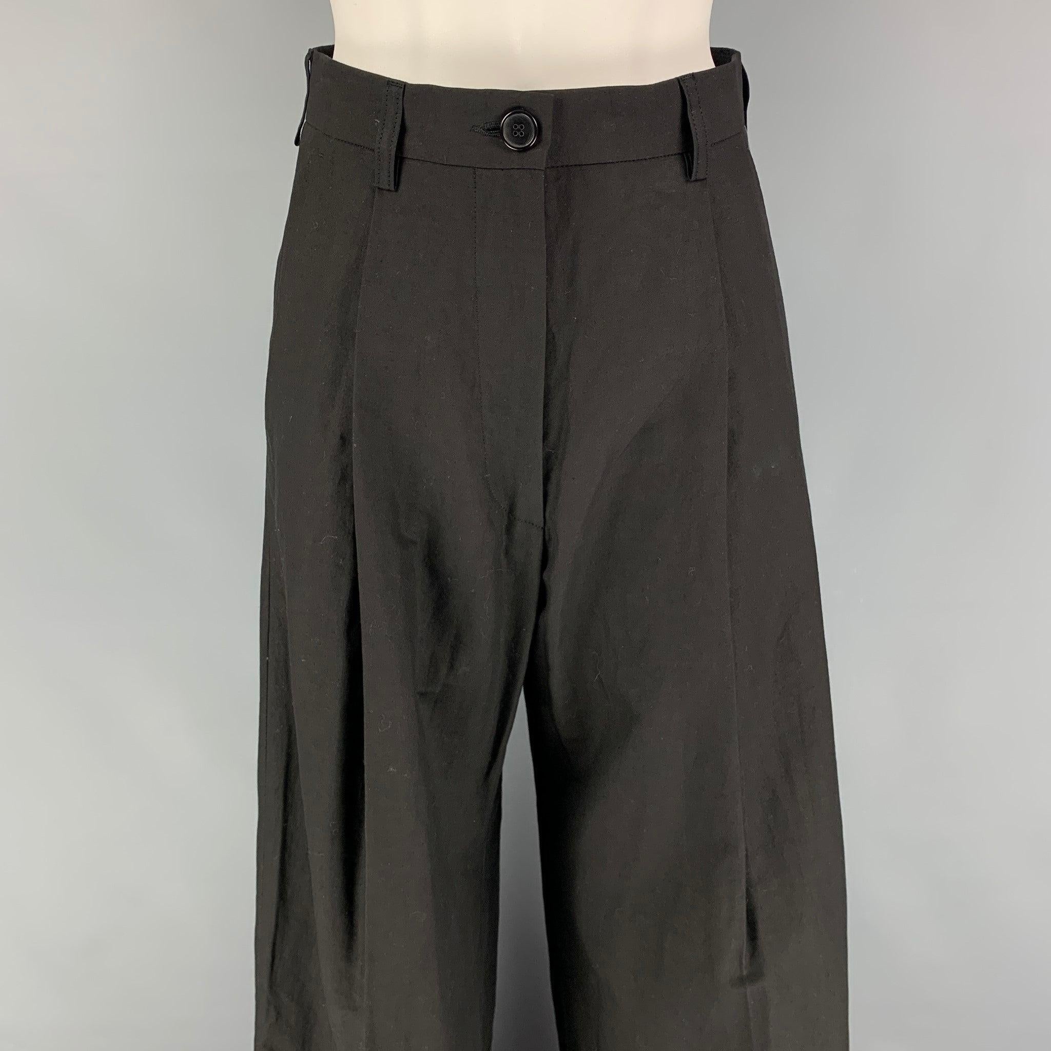 DRIES VAN NOTEN dress pants comes in a black cotton / linen featuring a wide leg style, pleated, cuffed, and a zip fly closure. Made in Romania.
Very Good
Pre-Owned Condition. 

Marked:   34 

Measurements: 
  Waist: 27 inches  Rise: 12.5 inches 