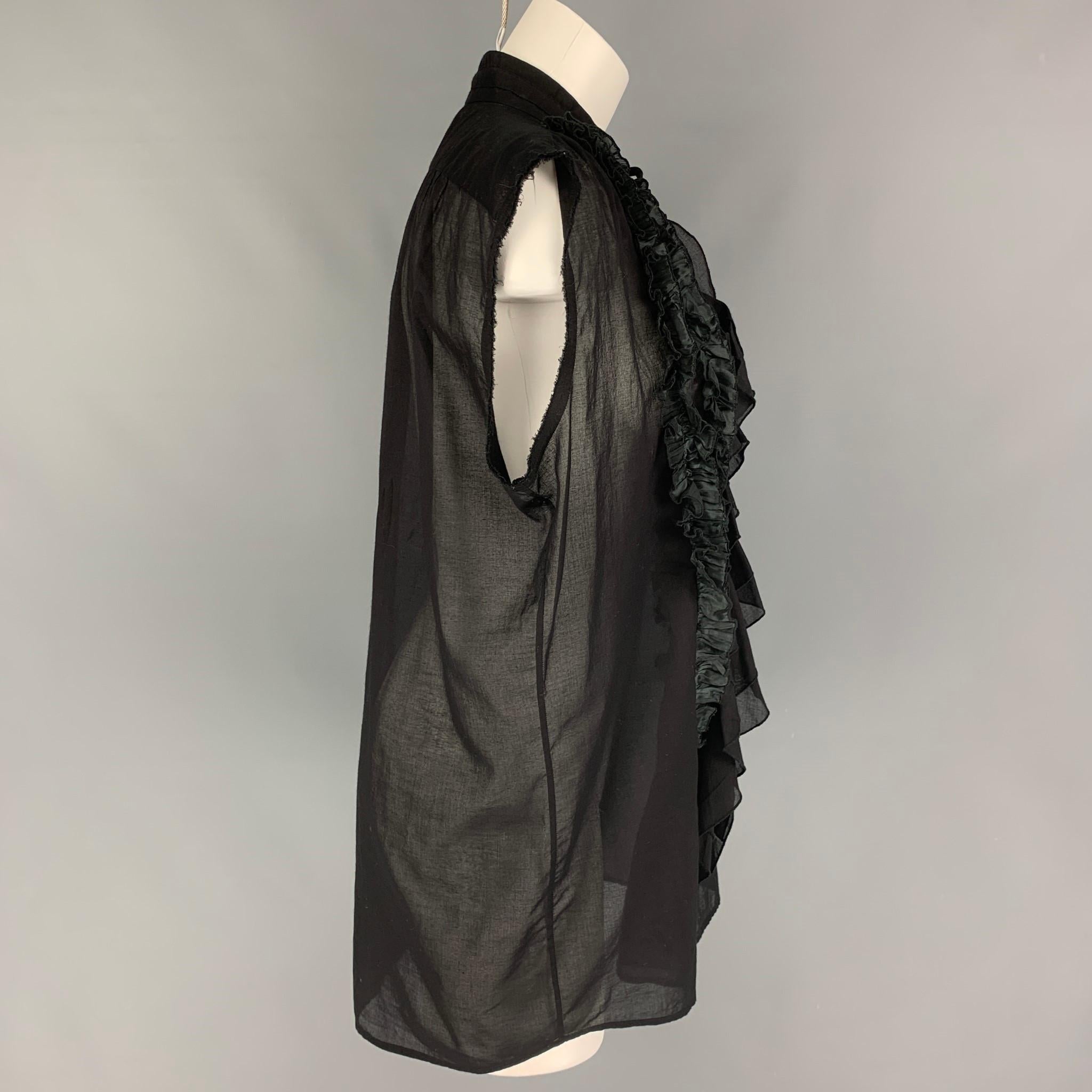 DRIES VAN NOTEN blouse comes in a black cotton featuring a sleeveless style, ruffle design, and a buttoned closure. 

Very Good Pre-Owned Condition.
Marked: 40

Measurements:

Shoulder: 18 in.
Bust: 44 in.
Length: 31 in. 