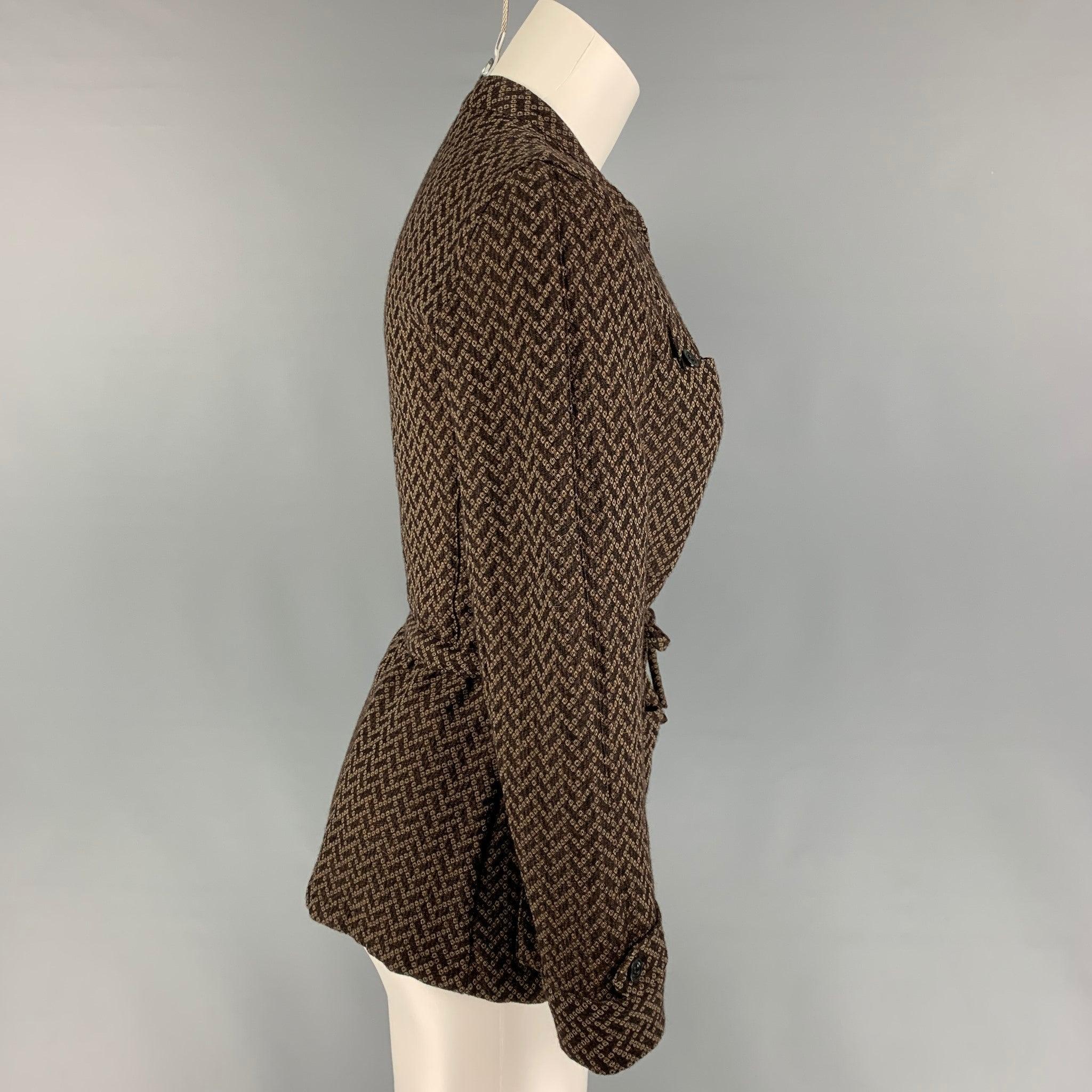 DRIES VAN NOTEN jacket comes in a brown & white textured wool / rayon featuring a nehru collar, drawstring detail, patch pockets, and a hook & loop closure.Very Good
Pre-Owned Condition. 

Marked:   36 

Measurements: 
 
Shoulder: 14.5 inches  Bust: