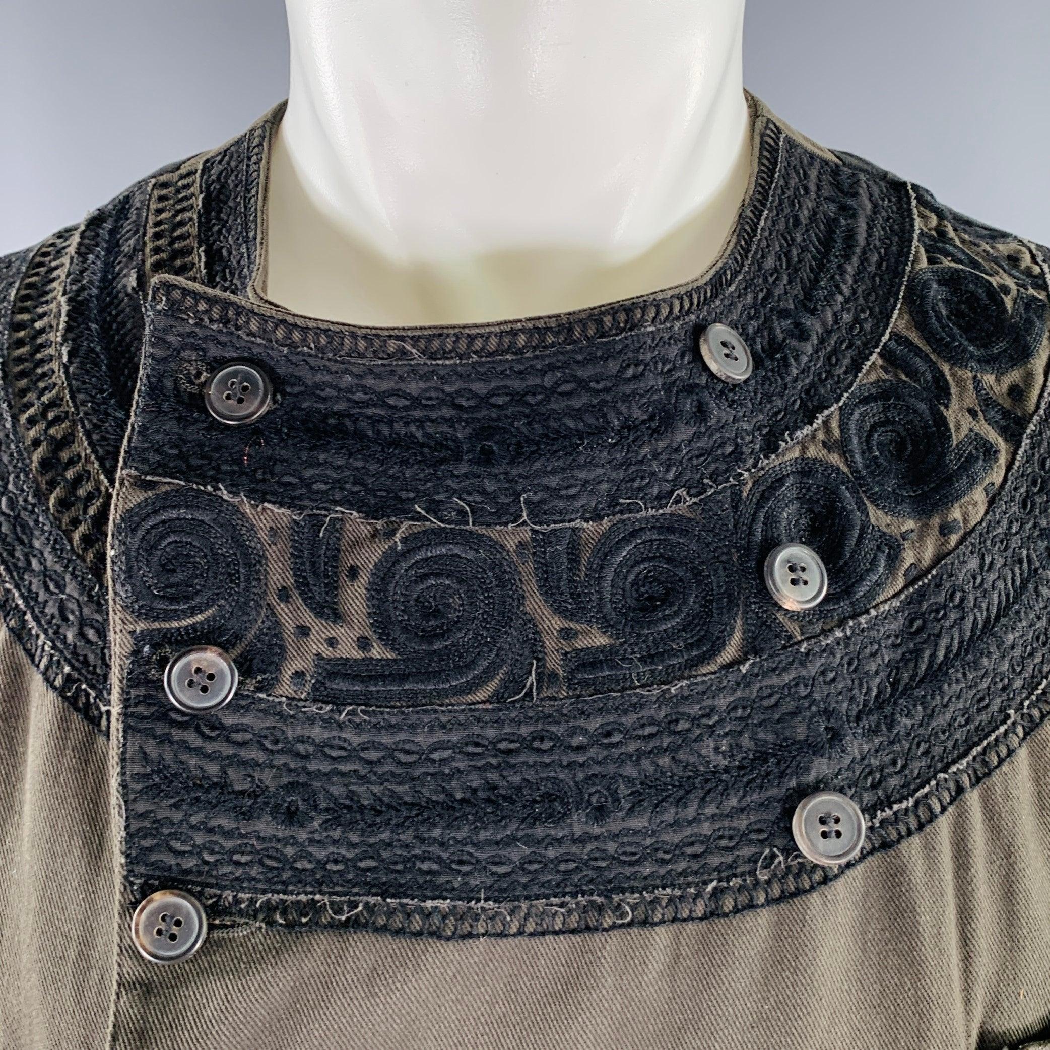 DRIES VAN NOTEN vest
in a dark green cotton blend fabric featuring black embroidery details on collar and pocket trims, double breasted style, and button closure. Made in Belgium.Excellent Pre-Owned Condition. 

Marked:   IT 50 

Measurements: 
