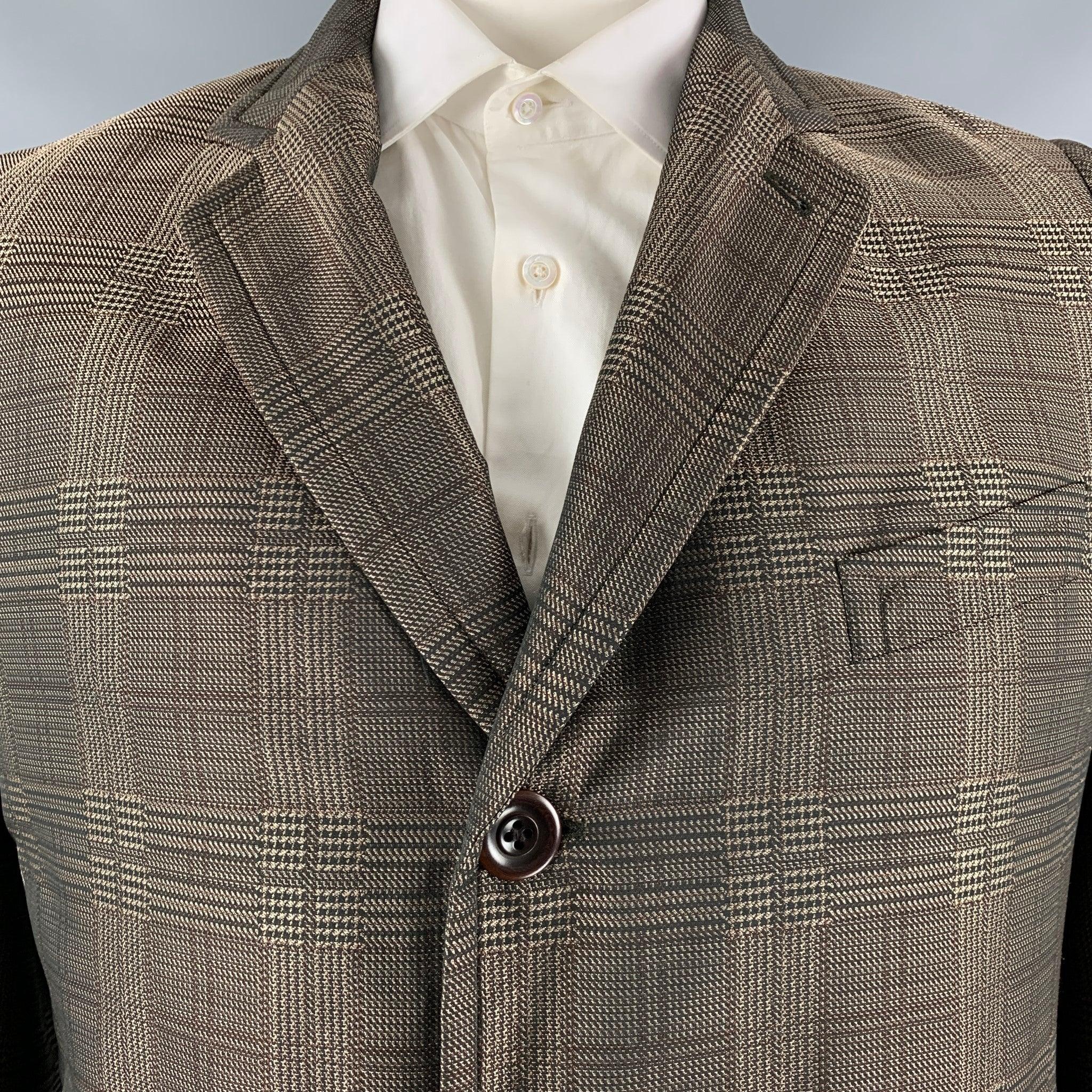 DRIES VAN NOTEN coat comes in a brown and taupe glenplaid polyester woven material with full grey plaid liner featuring a notch lapel, single breasted, double button front, and welt pockets. Made in Belgium.Very Good Pre-Owned Condition. Moderate