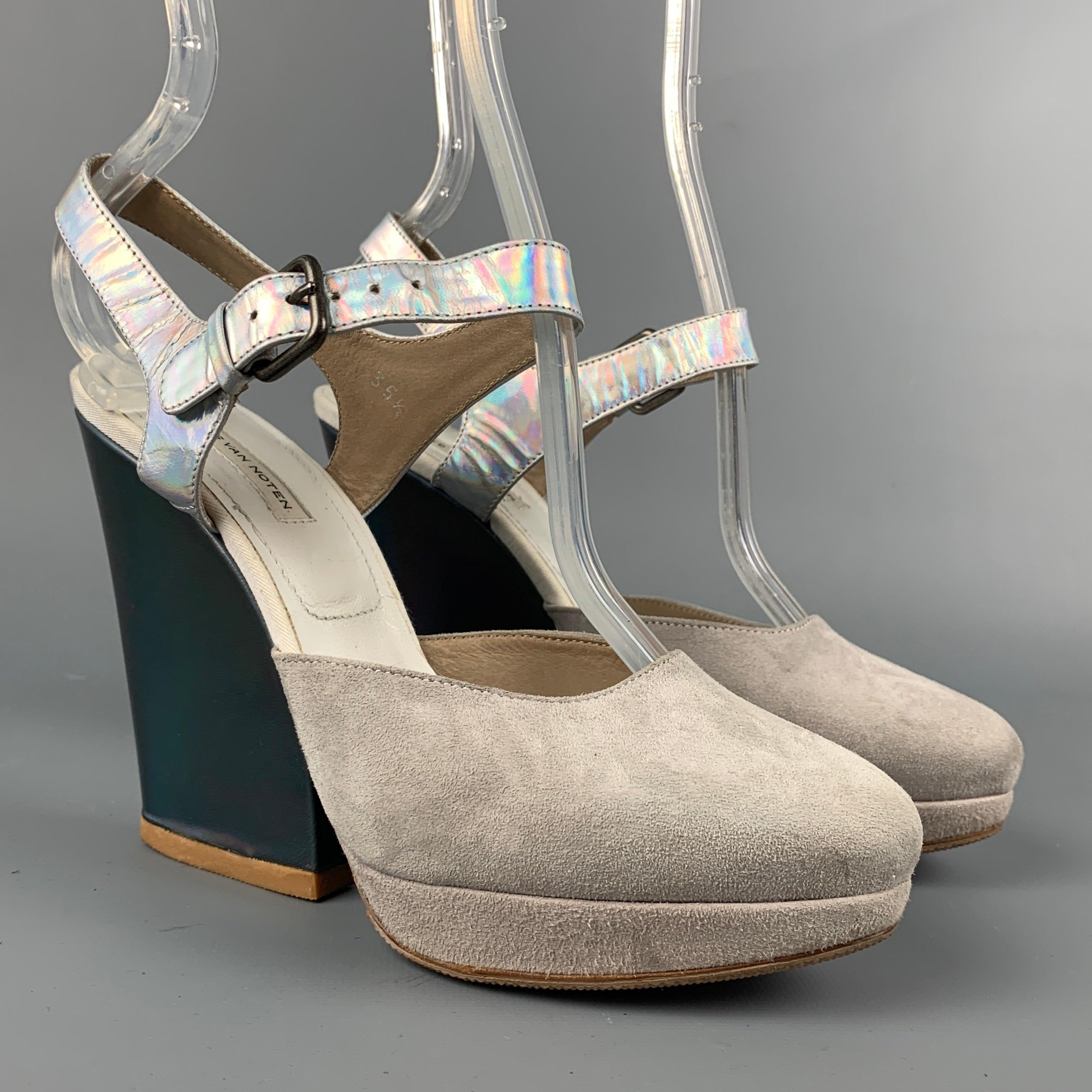 DRIES VAN NOTEN pumps comes in a grey suede featuring a iridescent strap and a stacked heel. Made in Italy.
Very Good
Pre-Owned Condition. 

Marked:   35.5 

Measurements: 
  Heel: 4 inches 
  
  
 
Reference: 111821
Category: Pumps
More Details
   