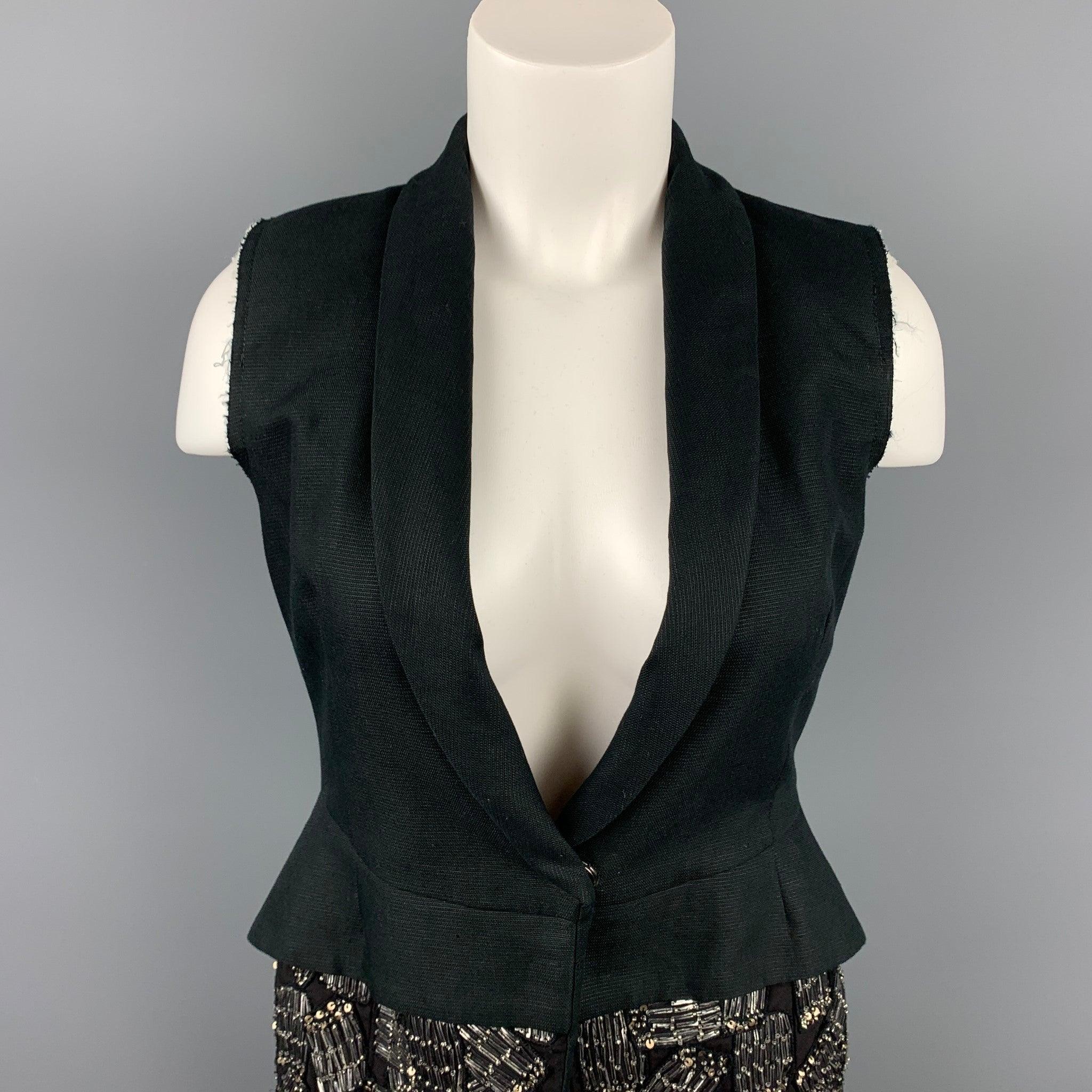 DRIES VAN NOTEN vest comes in a black cotton / linen with a beaded trim design featuring a full liner, shawl collar, and a single snap button closure.
Very Good
Pre-Owned Condition. 

Marked:   36 

Measurements: 
 
Shoulder: 13 inches  Bust: 32