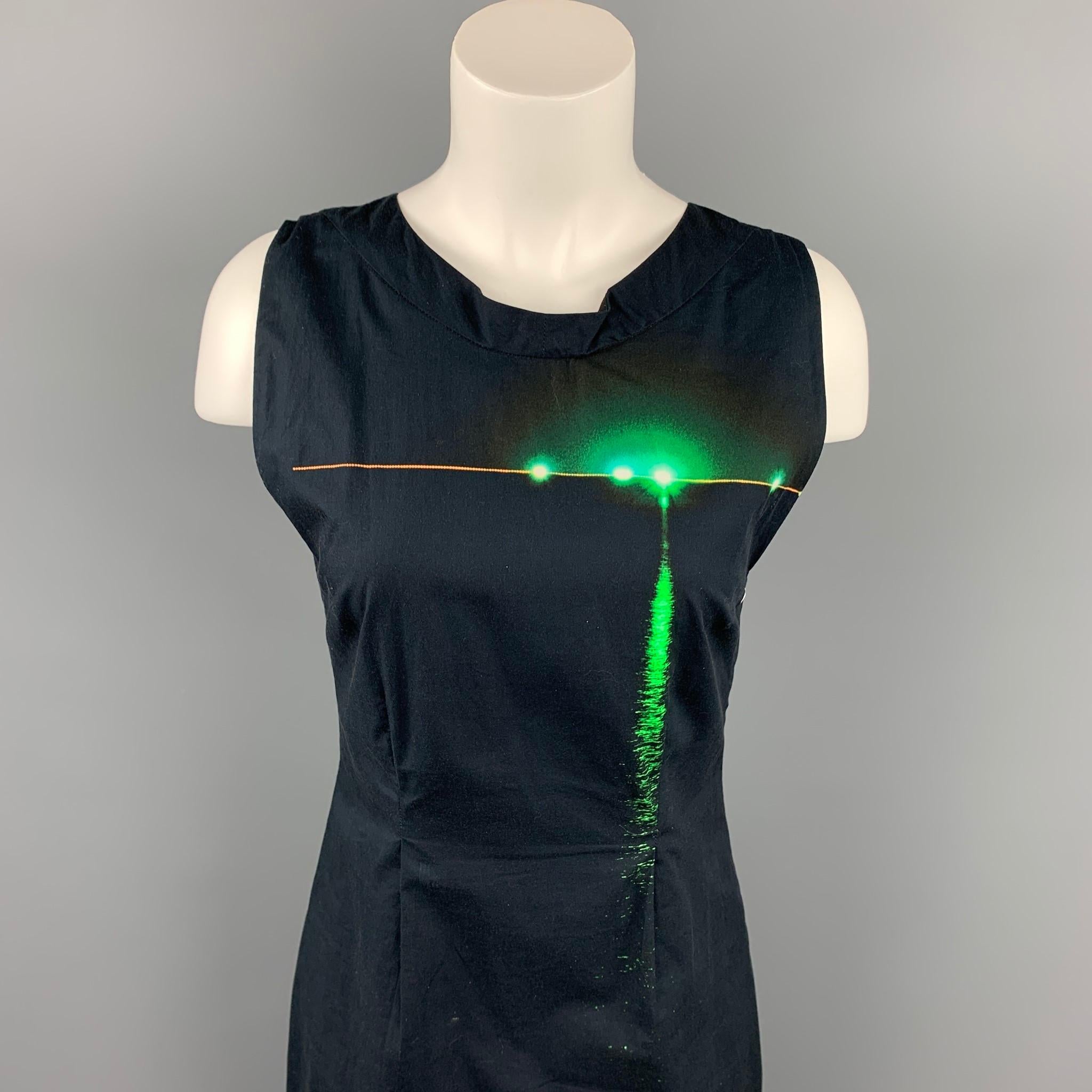 DRIES VAN NOTEN dress comes in a black & green poplin cotton featuring a shift style, sleeveless, and a back zip up closure. Made in Belgium.

Very Good Pre-Owned Condition.
Marked: 36

Measurements:

Bust: 30 in.
Waist: 29 in.
Hip: 36 in.
Length: