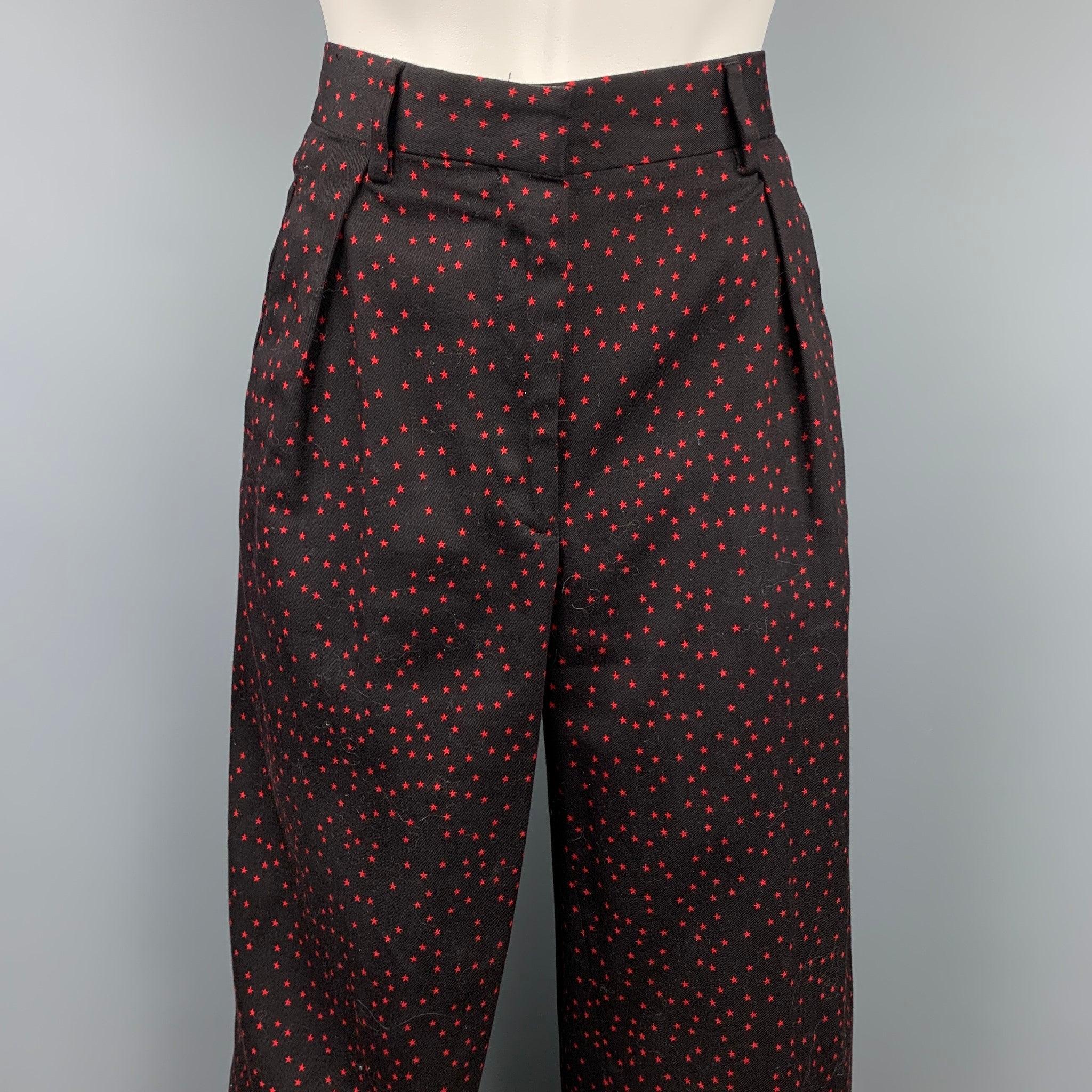 DRIES VAN NOTEN dress pants comes in a black & red star print cotton featuring a wide leg style, pleated, front tab, and a zip fly closure.
Very Good
Pre-Owned Condition. 

Marked:   36 

Measurements: 
  Waist: 32 inches  Rise: 11 inches Inseam: 25