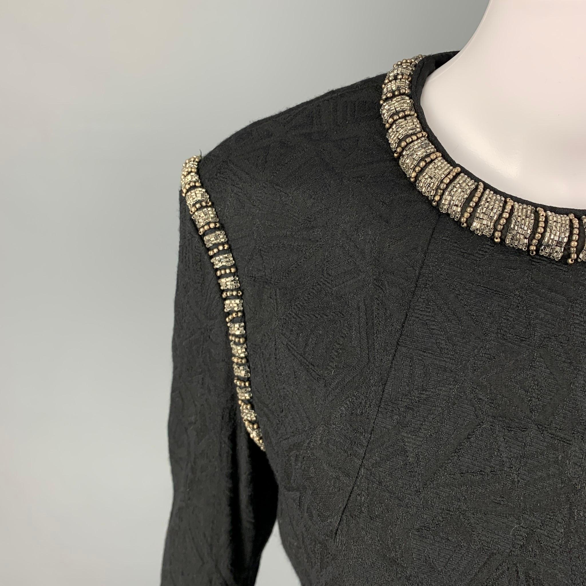 DRIES VAN NOTEN dress top comes in a black jacquard wool blend featuring a beaded trim, crew-neck, and a back zip up closure. 

Excellent Pre-Owned Condition.
Marked: 38

Measurements:

Shoulder: 16.5 in.
Bust: 34 in.
Sleeve: 22.5 in.
Length: 21.5