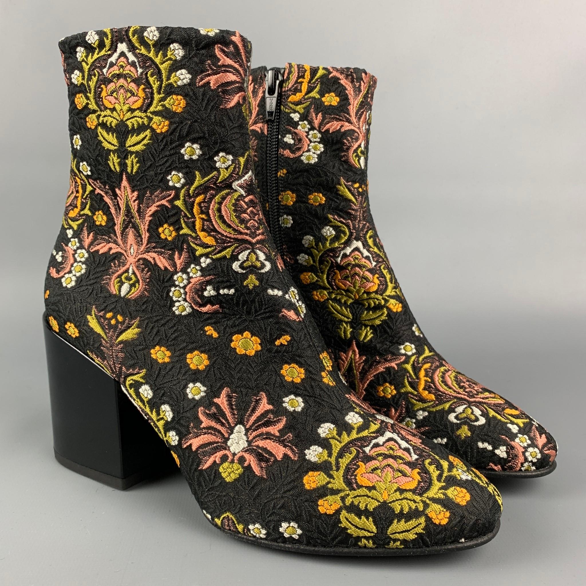 DRIES VAN NOTEN ankle boots comes in a multi-color jacquard material featuring a side zipper and a chunky heel. Made in Italy.

New Without Tags.
Marked: 19652 36

Measurements:

Length: 9 in.
Width: 3 in.
Height: 5 in.
Heel: 3 in.  

SKU: