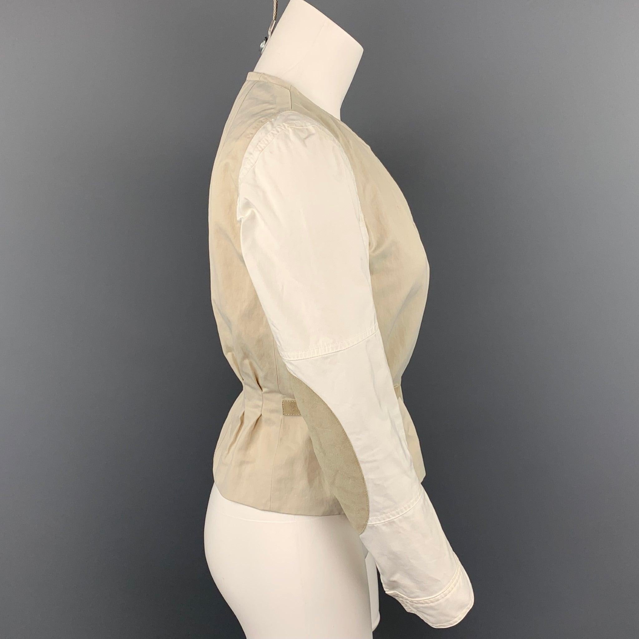 DRIES VAN NOTEN jacket comes in a off white polyester blend with a full liner featuring elbow patches, belted detail, slit pockets, and a snap button closure. Moderate wear.Good
Pre-Owned Condition. 

Marked:   36 

Measurements: 
 
Shoulder: 15