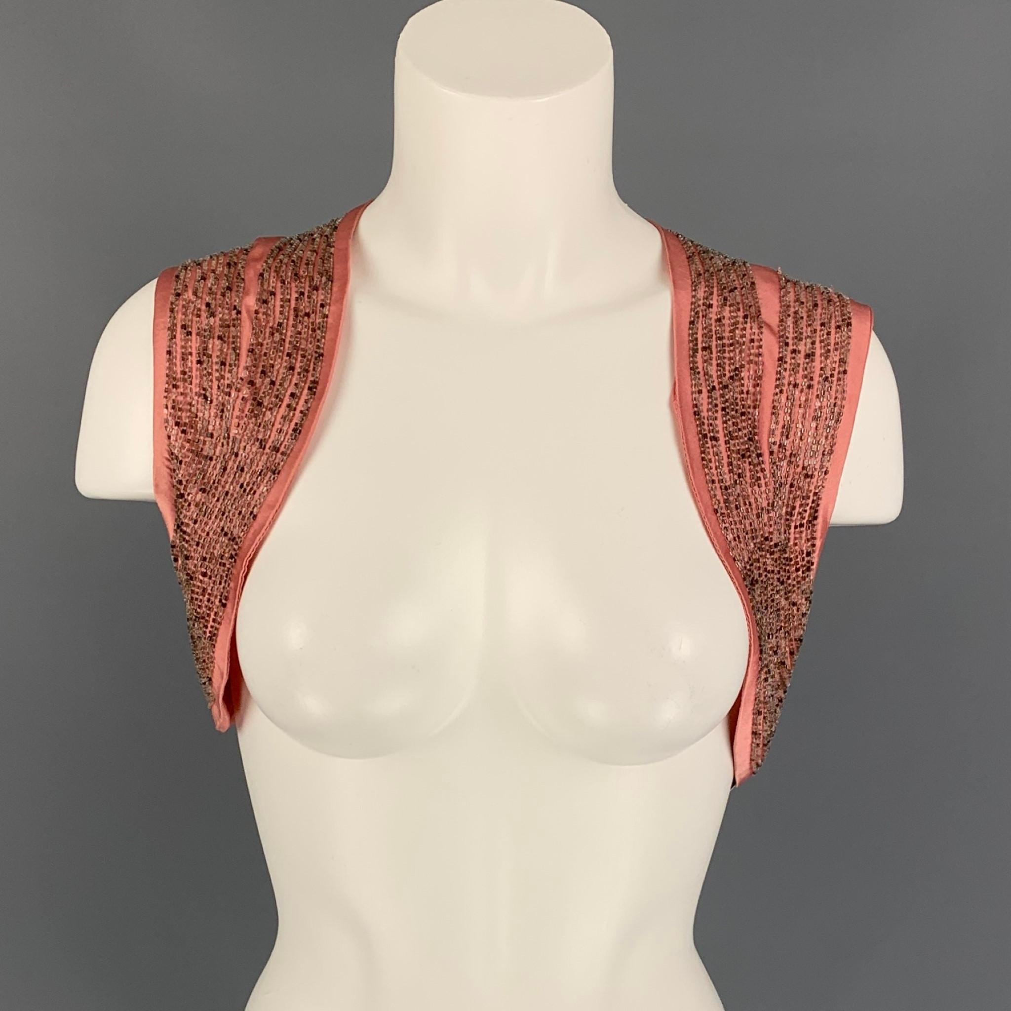 DRIES VAN NOTEN vest comes in a pink silk with a full liner featuring a beaded design throughout and a open front. Made in Belgium. 

Very Good Pre-Owned Condition.
Marked: 38

Measurements:

Shoulder: 14 in.
Length: 10 in. 