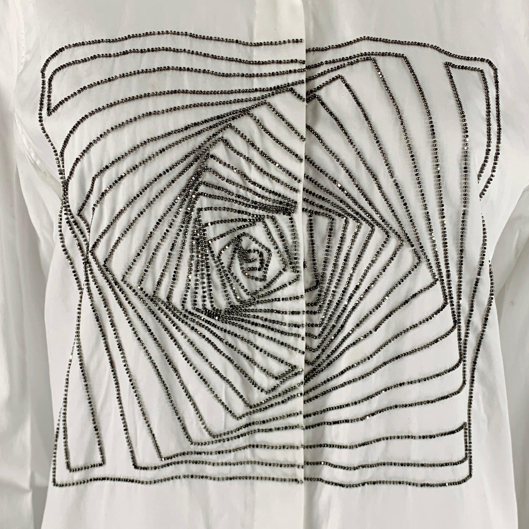 DRIES VAN NOTEN casual top
in a white cotton fabric featuring a silver tone beaded geometric design, long sleeves, and a hidden snap closure.Good Pre-Owned Condition.
Minor marks, please check photos. 

Marked:   38 

Measurements: 
 
Shoulder: 15.5