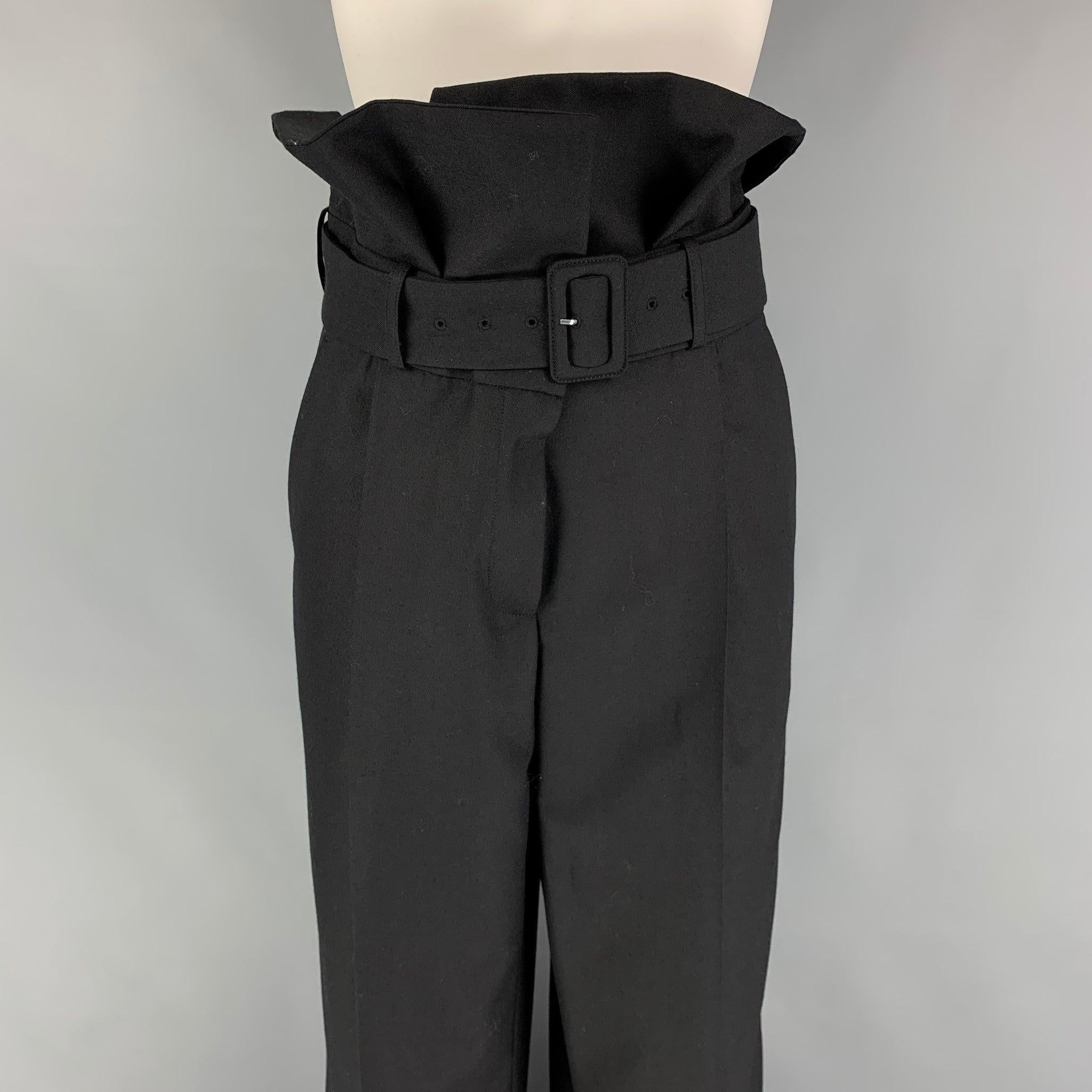 DRIES VAN NOTEN dress pants comes in a black wool featuring a high waisted style, belted, front tab, and a zip fly closure.New With Tags. 

Marked:   40 

Measurements: 
  Waist: 32 inches  Rise: 16 inches  Inseam: 35 inches 
  
  
 
Reference: