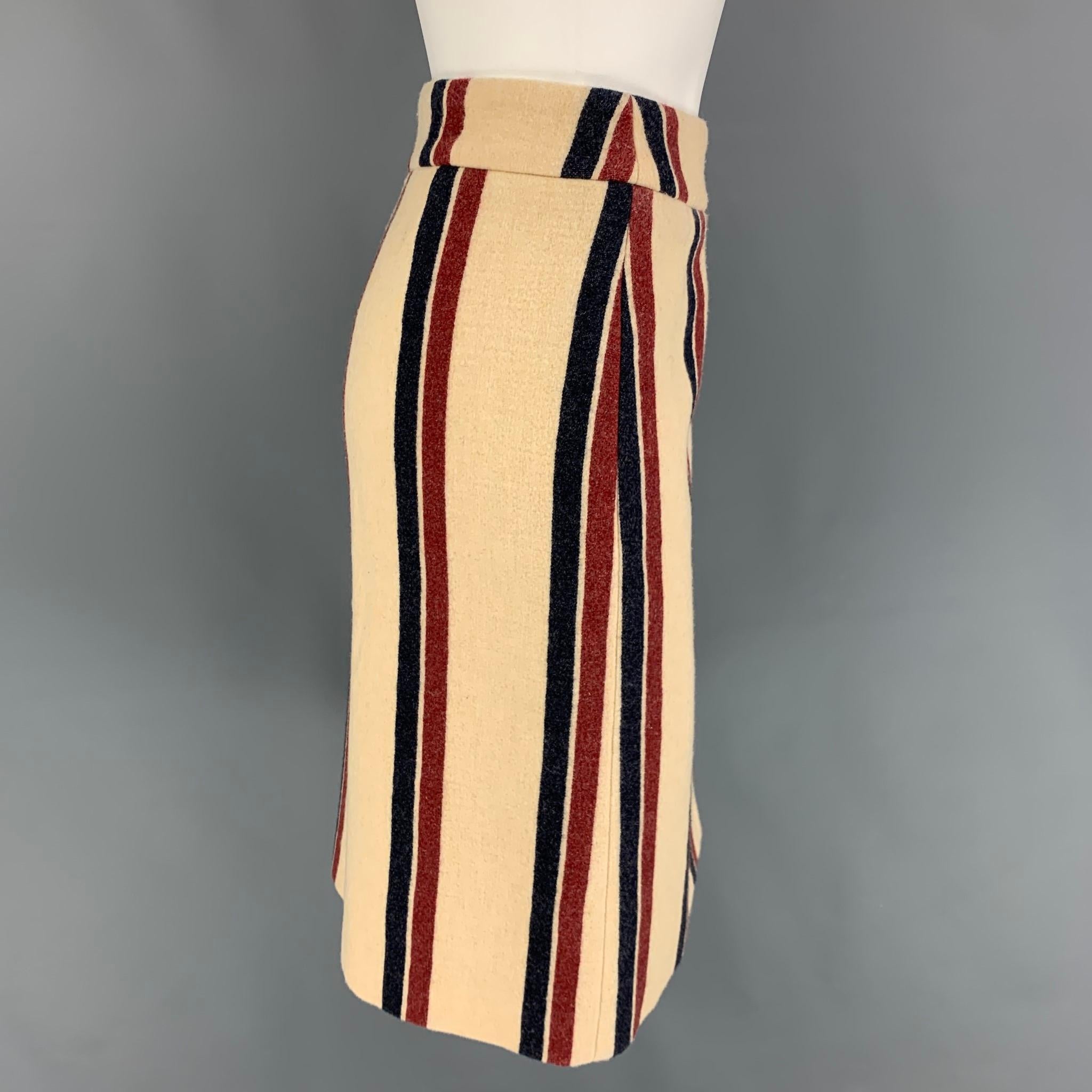 DRIES VAN NOTEN skirt comes in a cream & red stripe wool / polyamide featuring a pencil style and a back zip up closure. 

Very Good Pre-Owned Condition.
Marked: 40

Measurements:

Waist: 34 in.
Hip: 40 in.
Length: 23 in. 