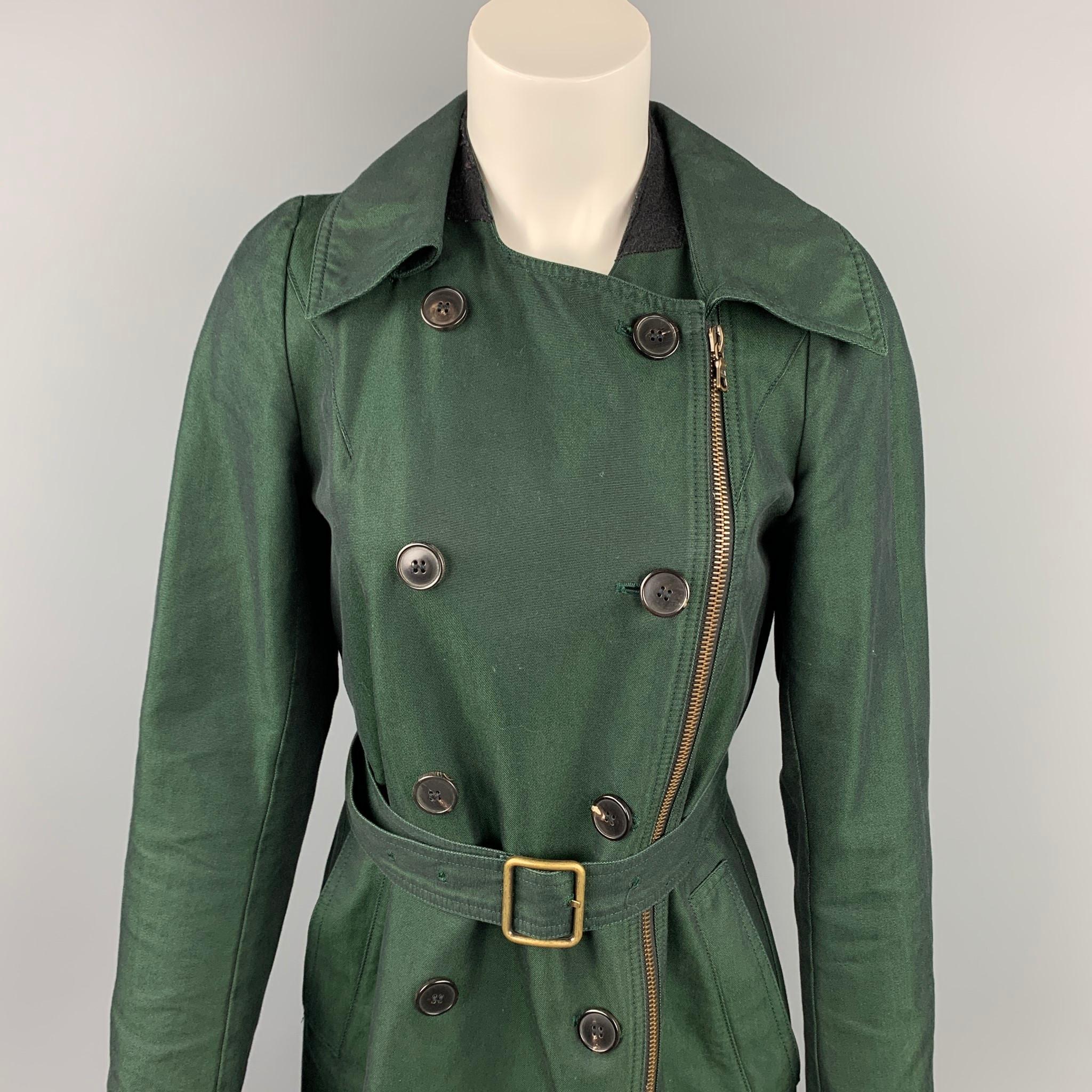 DRIES VAN NOTEN coat comes in a dark green cotton with a full liner featuring a belted style, slit pockets, zip up, and a double breasted closure. 

Very Good Pre-Owned Condition.
Marked: 38

Measurements:

Shoulder: 13 in.
Bust: 35 in.
Sleeve: 25