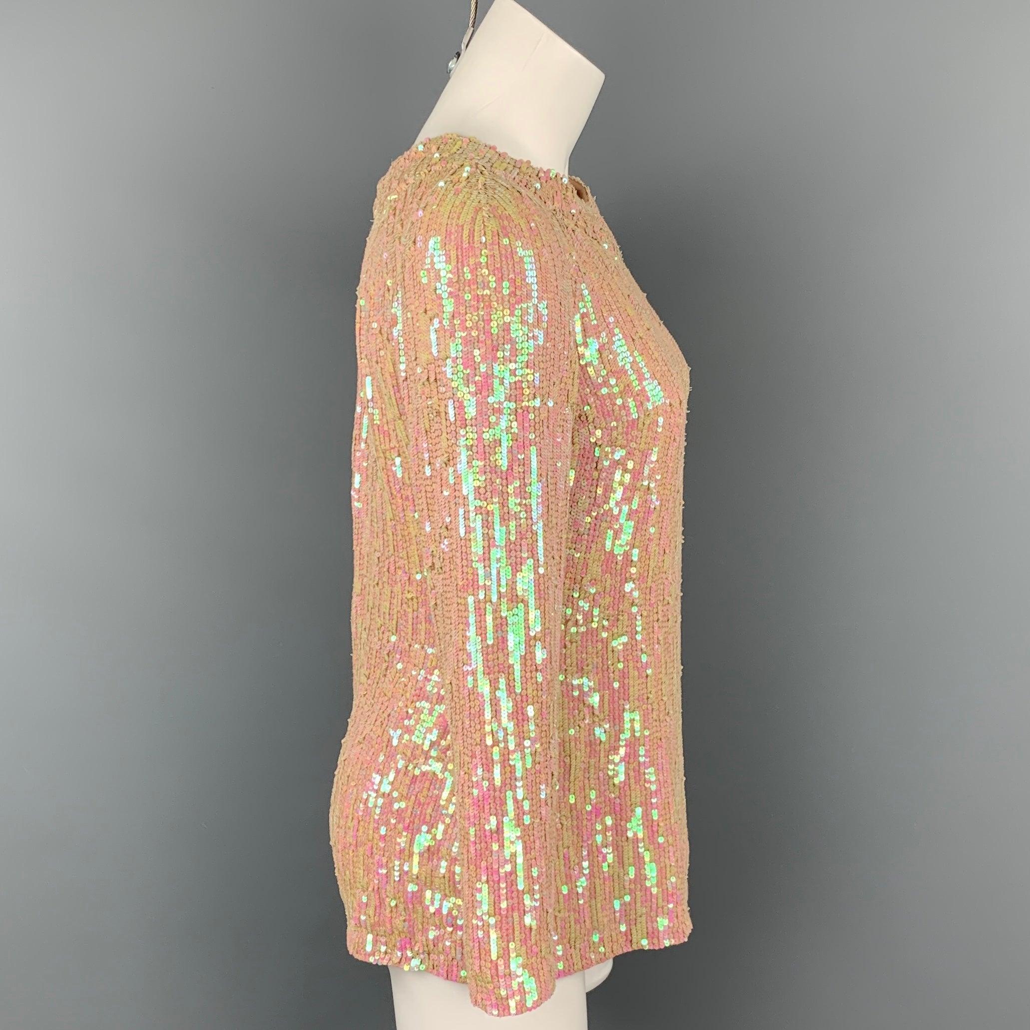 DRIES VAN NOTEN dress top comes in a iridescent & nude sequin silk featuring long sleeves and a back hook & loop closure.Very Good
Pre-Owned Condition. 

Marked:   38 

Measurements: 
 
Shoulder: 17.5 inches  Bust: 36 inches  Sleeve: 21 inches 
