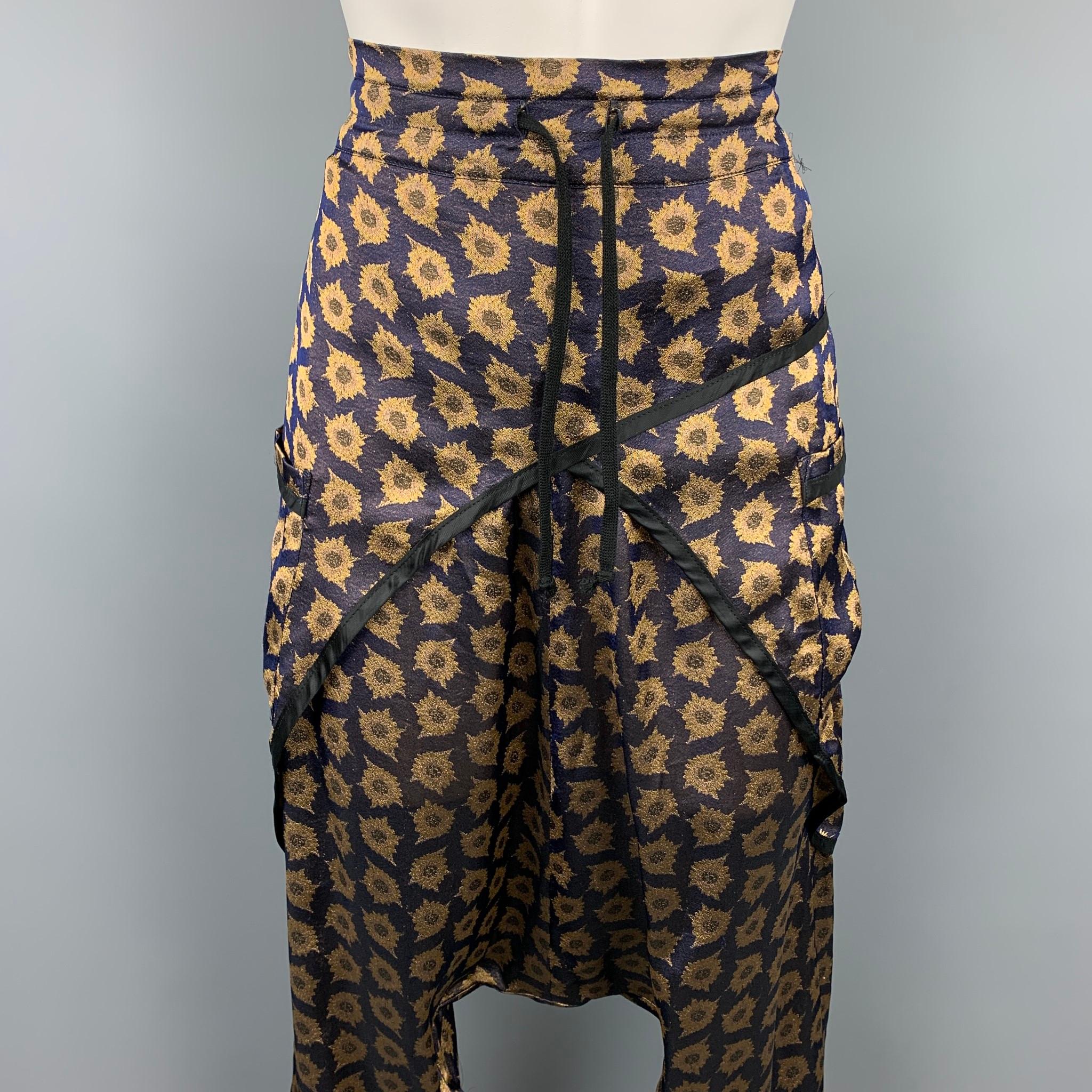 DRIES VAN NOTEN casual pants comes in a purple & gold print viscose/ silk featuring a drop-crotch style, front pockets, and a drawstring. 

Very Good Pre-Owned Condition.
Marked: 38

Measurements:

Waist: 32 in.
Rise: 24 in.
Inseam: 22 in. 

