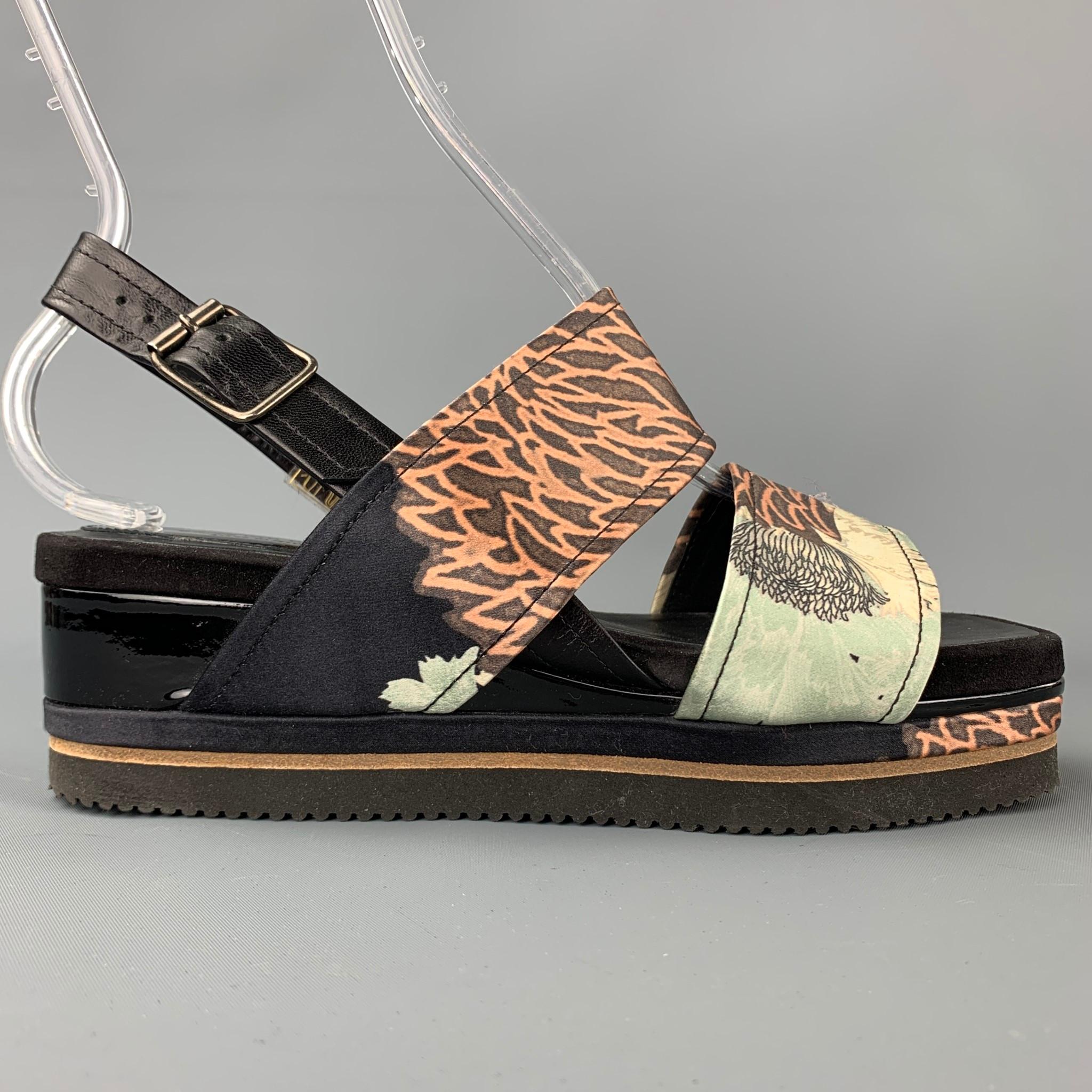 DRIES VAN NOTEN sandals comes in a multi-color tapestry print silk with a patent leather trim featuring a platform style and a slingback closure. Made in Italy.

Very Good Pre-Owned Condition.
Marked: EU 38.5

Measurements:

Platform: 2.25 in. 