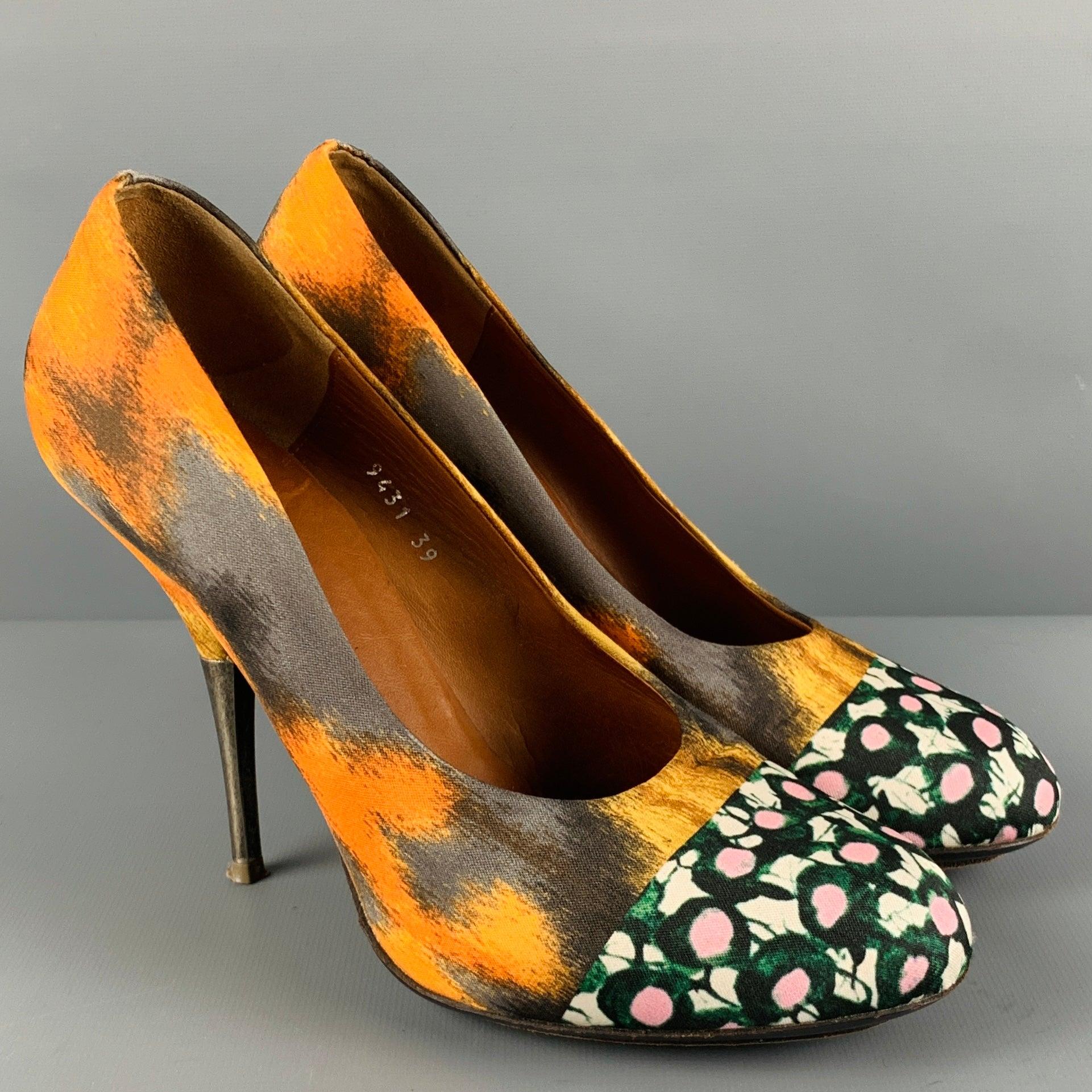 DRIES VAN NOTEN pumps
in a multi-color silk fabric featuring mixed abstract patterns, and shiny silver tone heel.Excellent Pre-Owned Condition. 

Marked:   9431 39 

Measurements: 
  Heel: 4.5 inches 
  
  
 
Reference No.: 128746
Category: