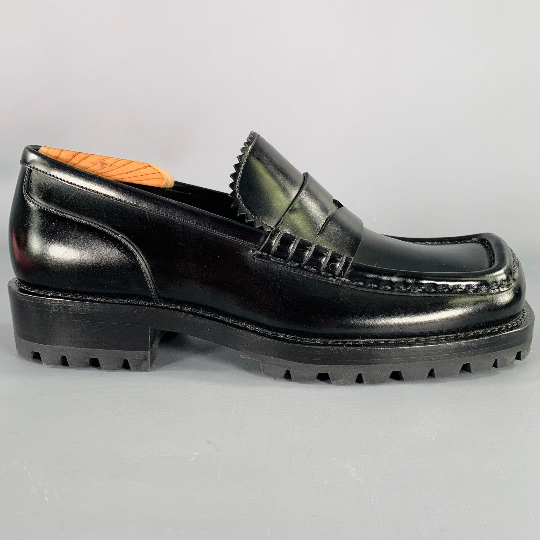 DRIES VAN NOTEN loafers in a black leather featuring a penny style, chunky soles, and square toe. Shoe trees not included. Made in Italy.Excellent Pre-Owned Condition. 

Marked:   DU094Outsole: 11 inches  x 4 inches  
  
  
 
Sui Generis Reference: