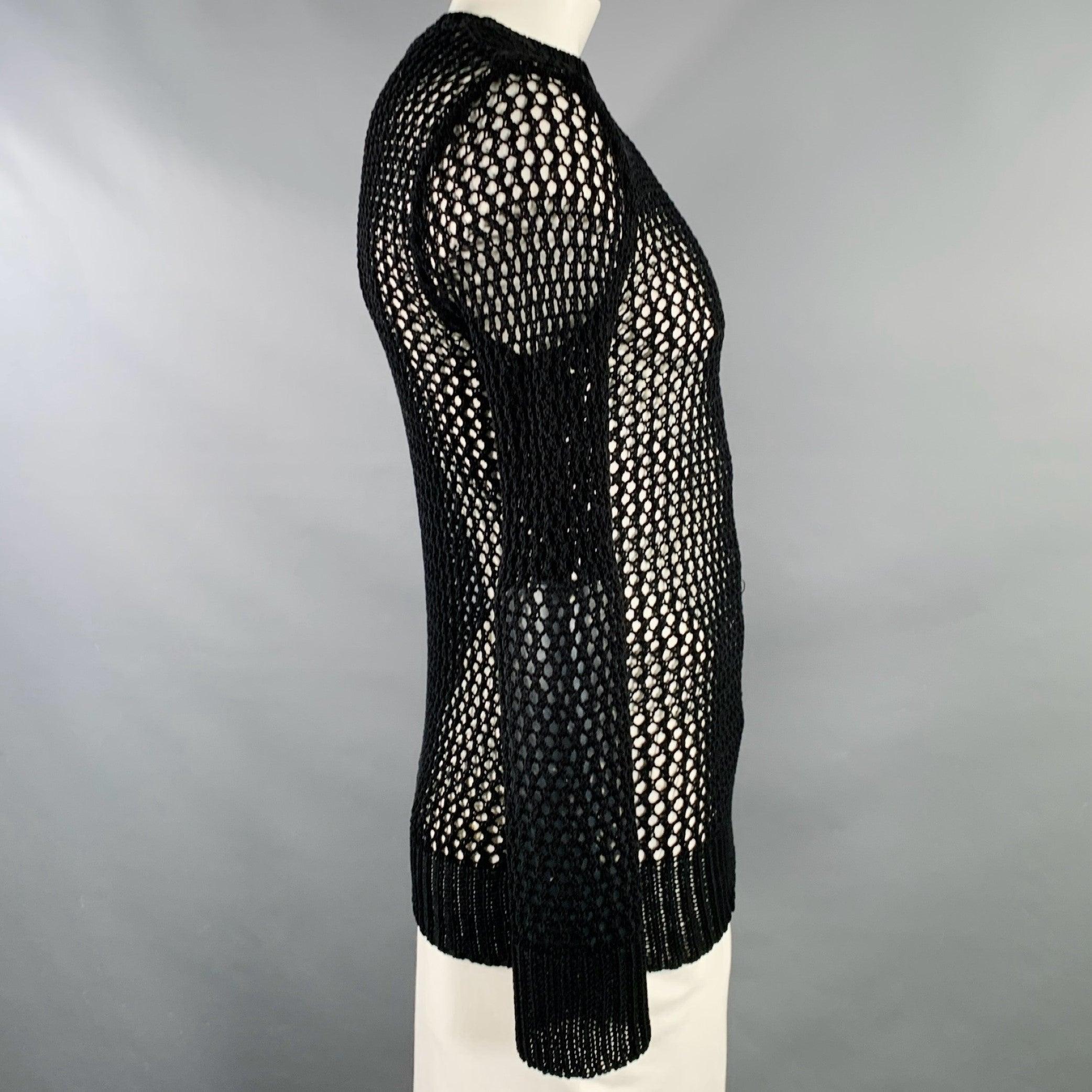 DRIES VAN NOTEN pullover
in a black crochet fishnet featuring long sleeves and crew neck.Very Good Pre-Owned Condition. Minor signs of wear. Fabric and care tags removed. 

Marked:   L 

Measurements: 
 
Shoulder: 18.5 inches Chest: up to 46 inches