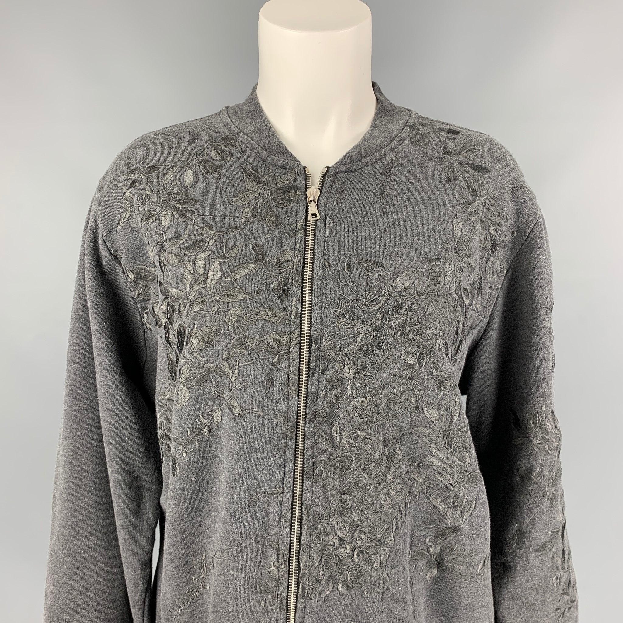 DRIES VAN NOTEN jacket comes in a dark gray cotton with embroidered details featuring a bomber style, and a full zip up closure.
Very Good
Pre-Owned Condition. 

Marked:   L 

Measurements: 
 
Shoulder: 18 inches  Bust: 42 inches  Sleeve: 25 inches 