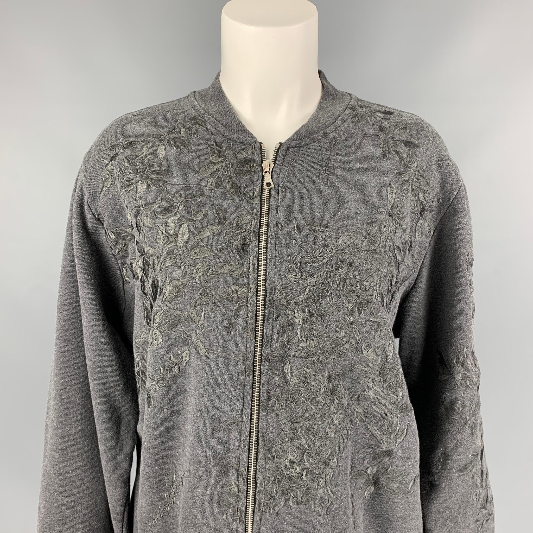 DRIES VAN NOTEN jacket comes in a dark gray cotton with embroidered details featuring a bomber style, and a full zip up closure. 

Very Good Pre-Owned Condition.
Marked: L

Measurements:

Shoulder: 18 in.
Bust: 42 in.
Sleeve: 25 in.
Length: 24 in. 