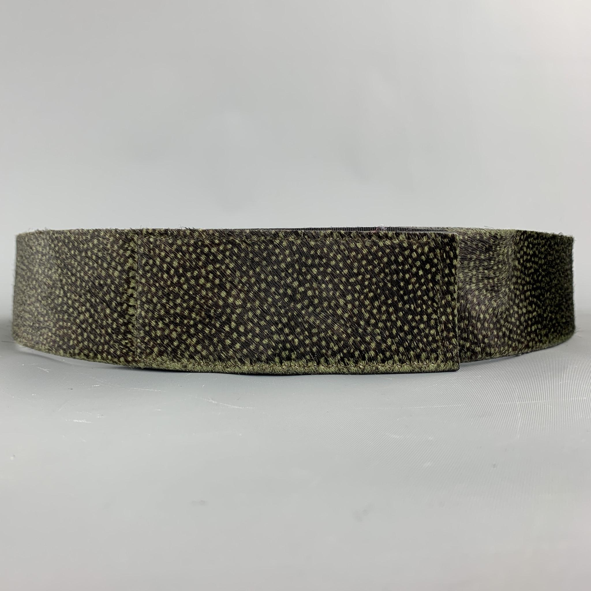 DRIES VAN NOTEN belt comes in a brown & green dot print calf hair featuring a velcro closure. Made in Italy.

Very Good Pre-Owned Condition.
Marked: 85

Length: 38.5 in. 
Width: 2 in. 