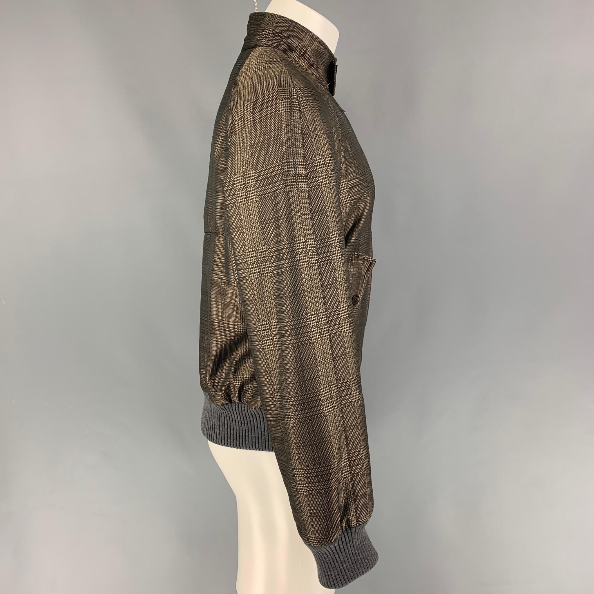DRIES VAN NOTEN jacket comes in a brown & grey plaid polyester with a flannel lining featuring a bomber style, ribbed hem, flap pockets, buttoned collar, and a full zip up closure. 

Excellent Pre-Owned Condition.
Marked: M

Measurements:

Shoulder: