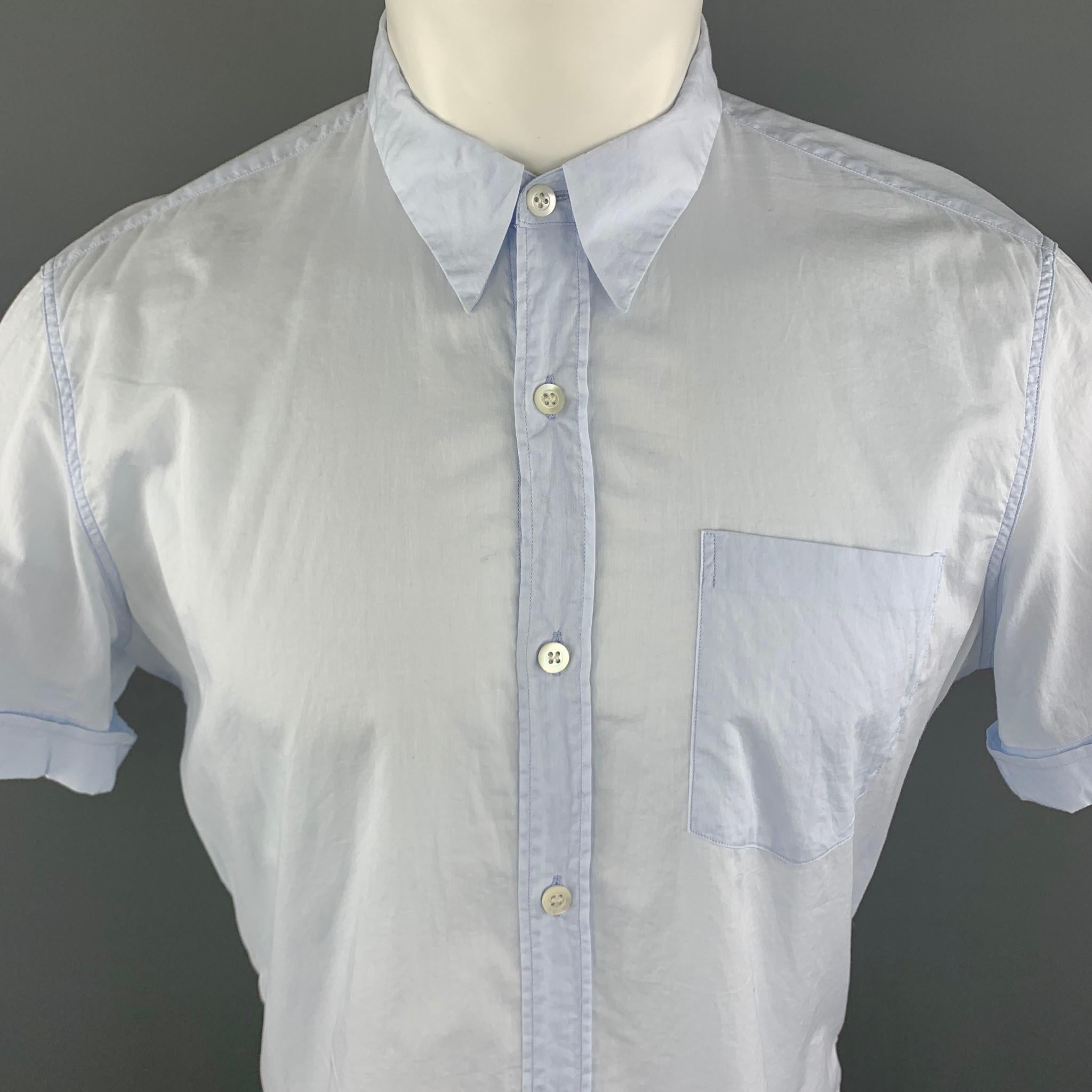 DRIES VAN NOTEN short sleeve shirt comes in a solid light blue cotton material, with a pointed collar, a patch pocket, cuffed sleeves, button up.

Excellent Pre-Owned Condition.
Marked: IT 50

Measurements:

Shoulder: 17 in. 
Chest: 44 in. 
Sleeve: