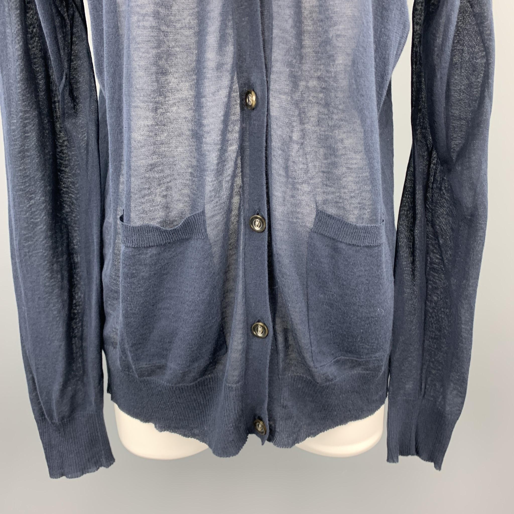 DRIES VAN NOTEN oversized cardigan comes in a sheer burnout cotton cashmere blend knit with a V neck and patch pockets. Made in Belgium.

Excellent Pre-Owned Condition.
Marked: Medium

Measurements:

Shoulder: 20 in.
Bust: 48 in.
Sleeve: 26
