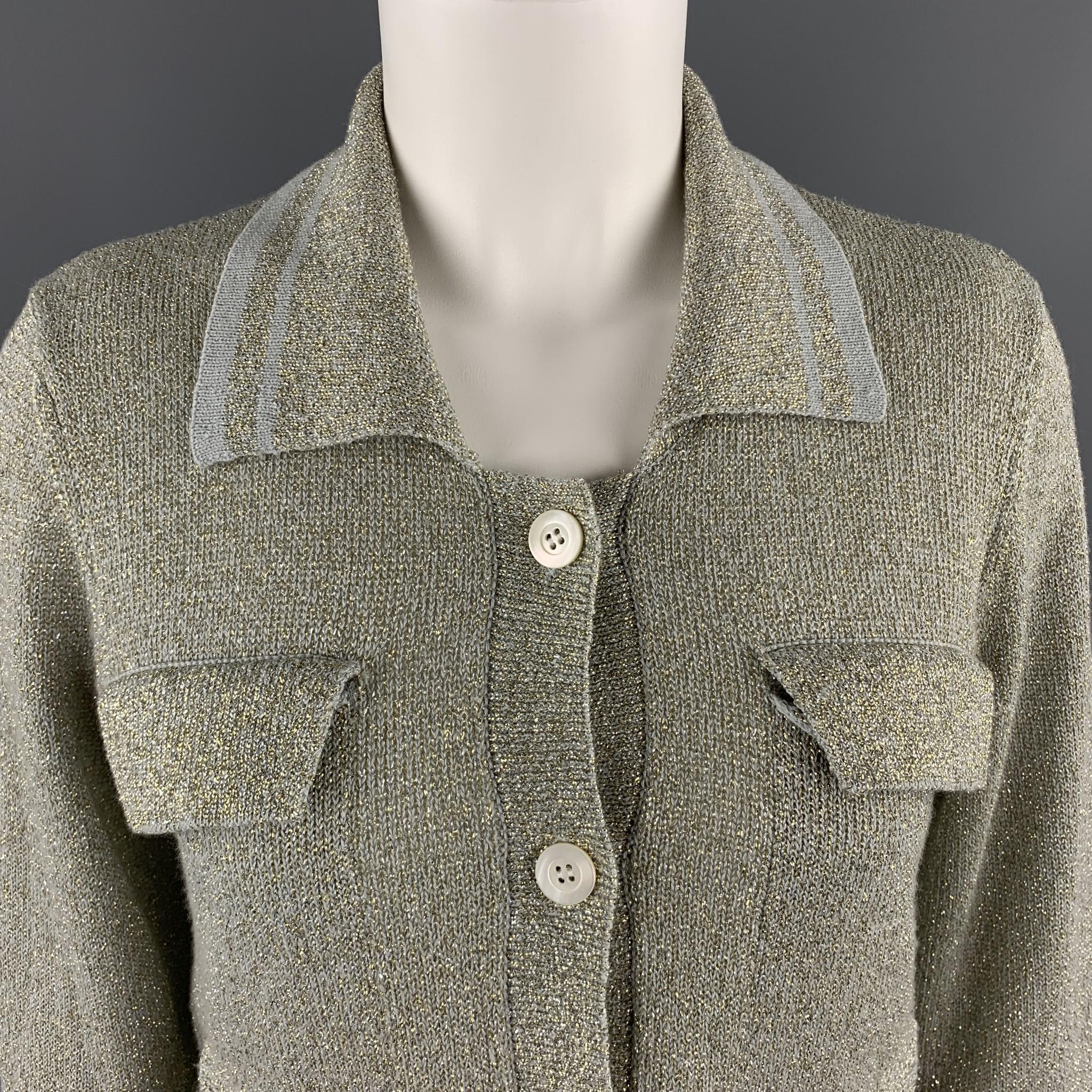 DRIES VAN NOTEN cardigan comes in silver and gold metallic sparkle knit with a striped collar, button front, and flap cheat pockets.  Made in Belgium.

Excellent Pre-Owned Condition.
Marked: Medium

Measurements:

Shoulder: 15 in.
Bust: 34