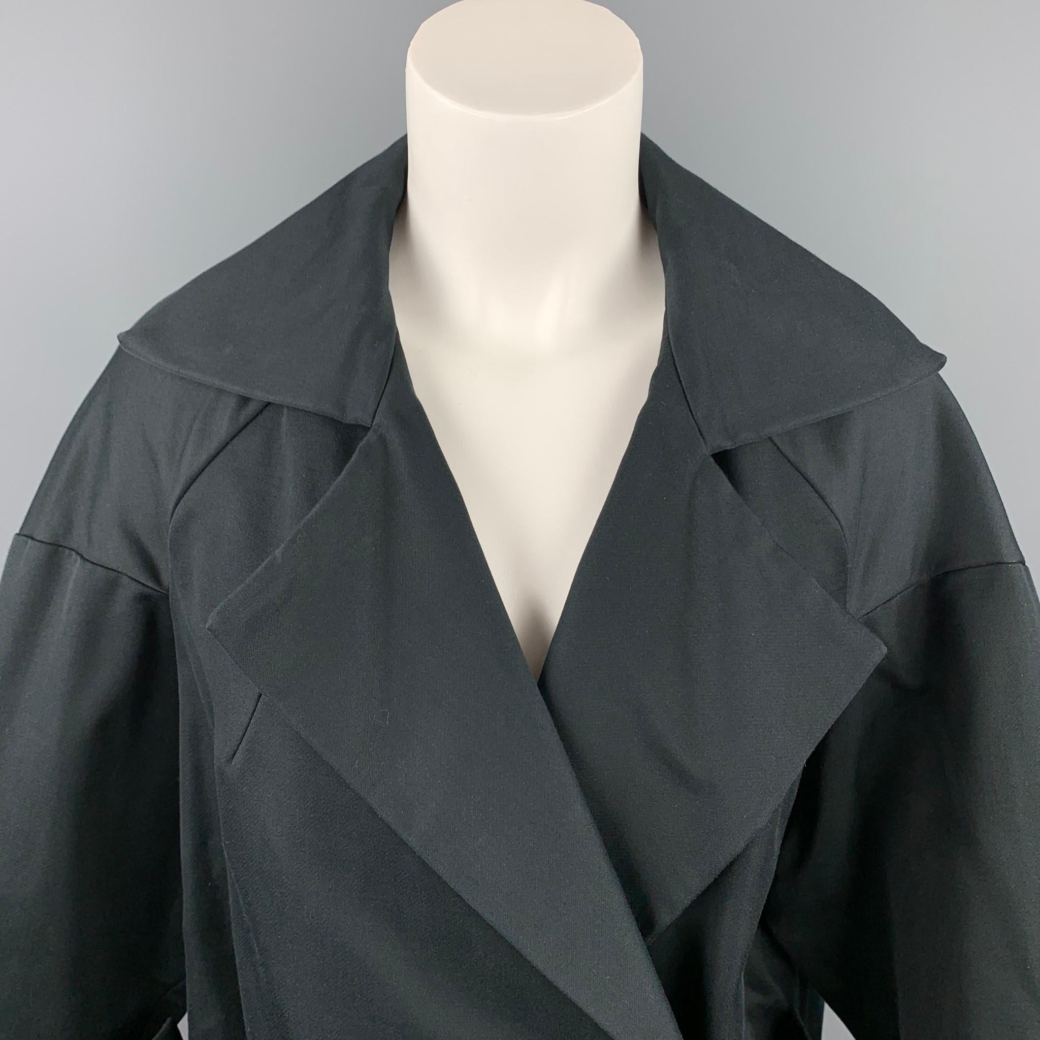 DRIES VAN NOTEN jacket comes in a black cotton / polyamide with a full liner featuring a oversized style, flap pockets, notch lapel, and snap button closure. 

Very Good Pre-Owned Condition.
Marked: S

Measurements:

Shoulder: 22 in.
Bust: 42