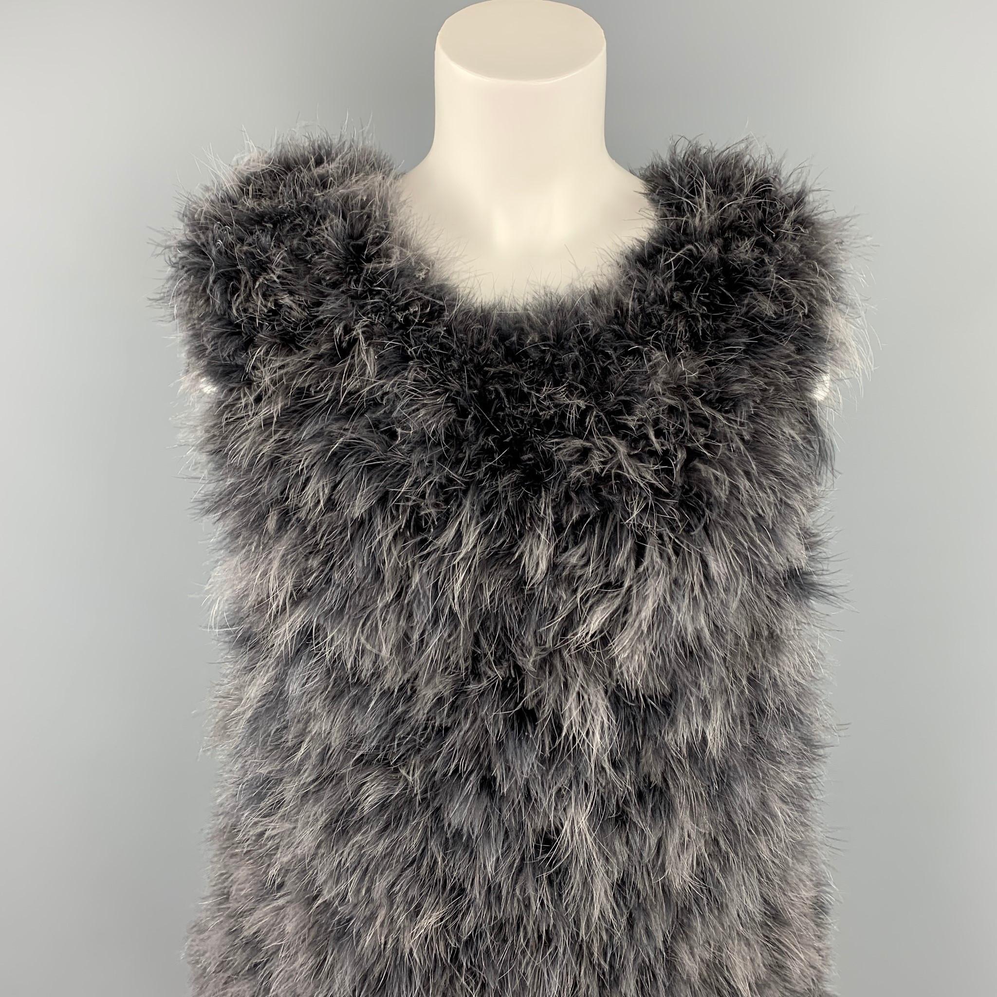 DRIES VAN NOTEN vest comes in grey feather featuring a oversized style. Made in Belgium.

Very Good Pre-Owned Condition.
Marked: S

Measurements:

Bust: 38 in.
Length: 21 in. 

