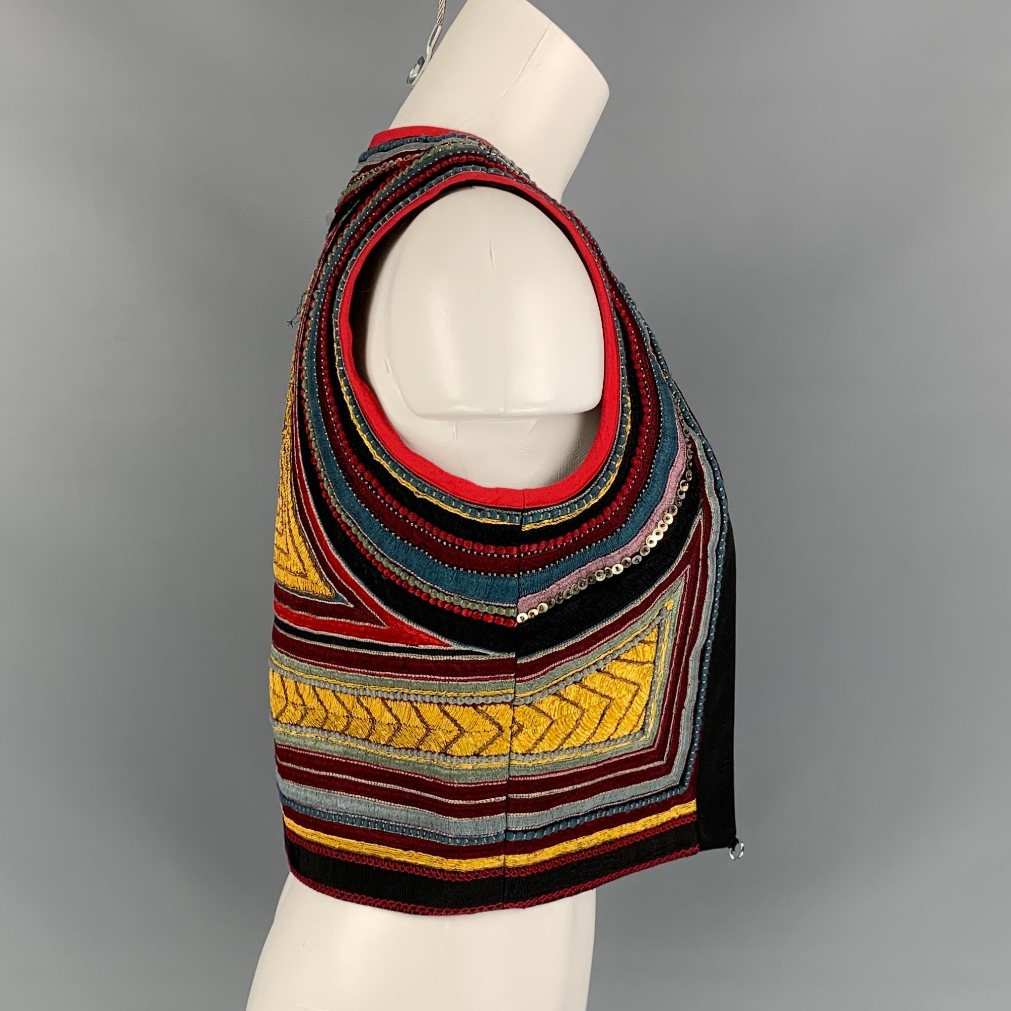 DRIES VAN NOTEN vest comes in a multi-color cotton with embroidered details throughout featuring a cropped style, loop details, beaded, and a open front. Handmade

New With Tags. Missing strap.
Marked: S
Original Retail Price: