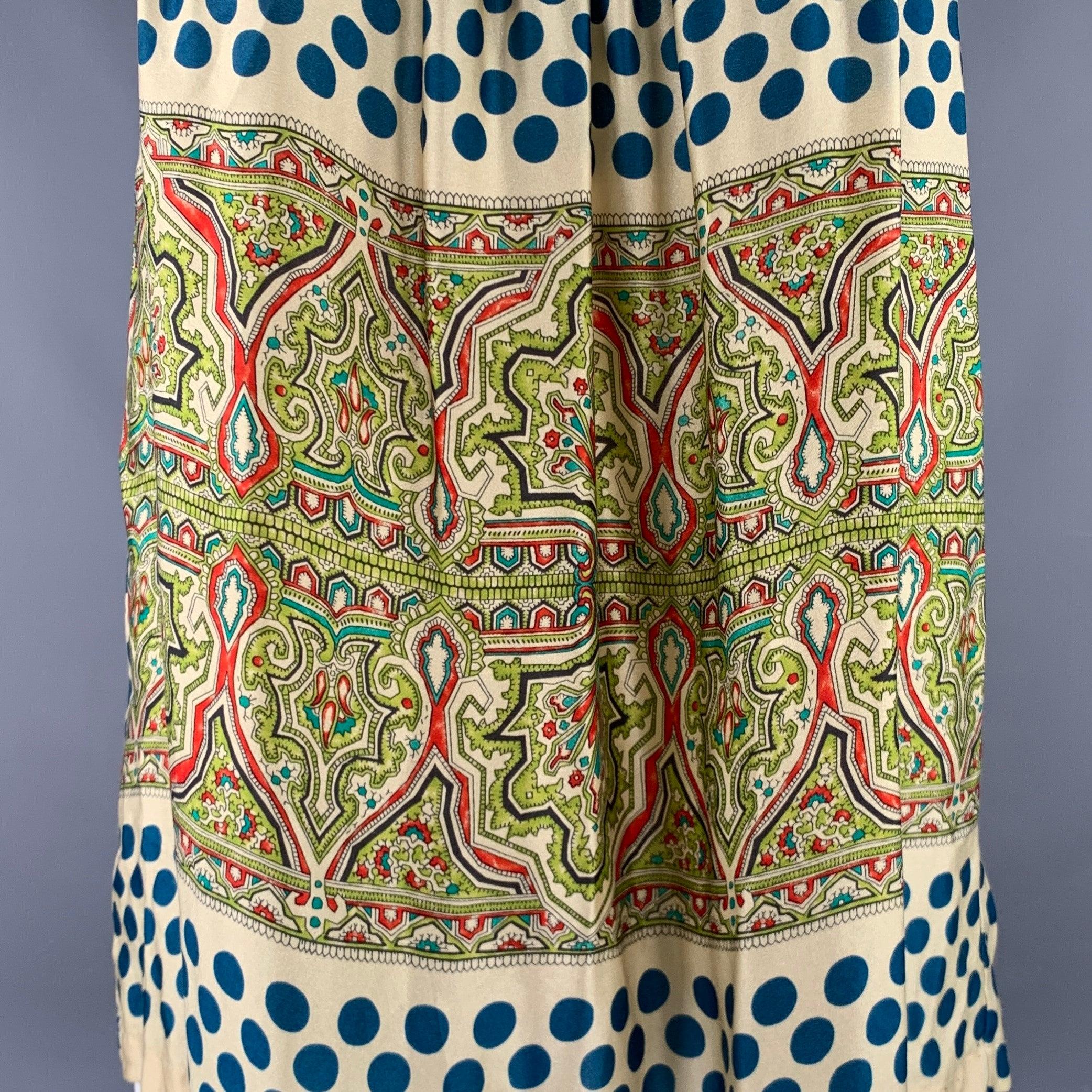 Top informal DRIES VAN NOTEN
en tejido de seda multicolor con estilo de tirantes, estampado de lunares con paisley en el centro y cierre de botones en el hombro. Fabricado en Bélgica.Excelente estado de conservación. 

Marcado:   S 

Medidas: 
