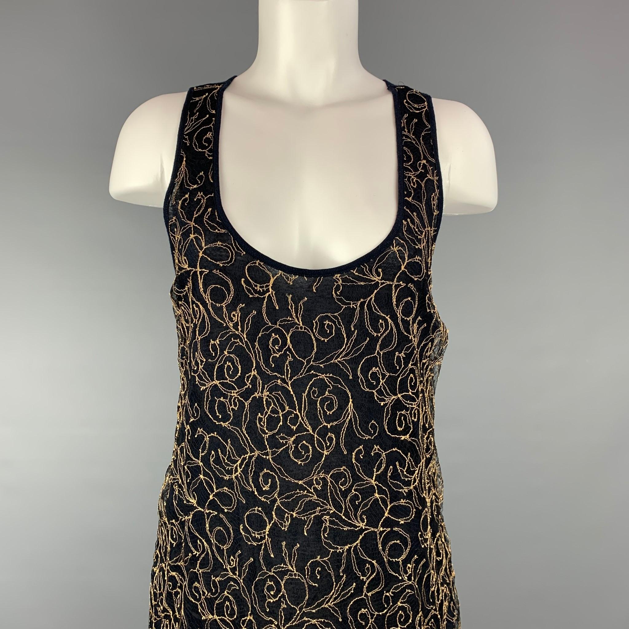 DRIES VAN NOTEN tank top comes in a navy & beige embroidered lace featuring a deep neckline. 

Very Good Pre-Owned Condition.
Marked: S

Measurements:

Bust: 32 in.
Length: 26.5 in. 