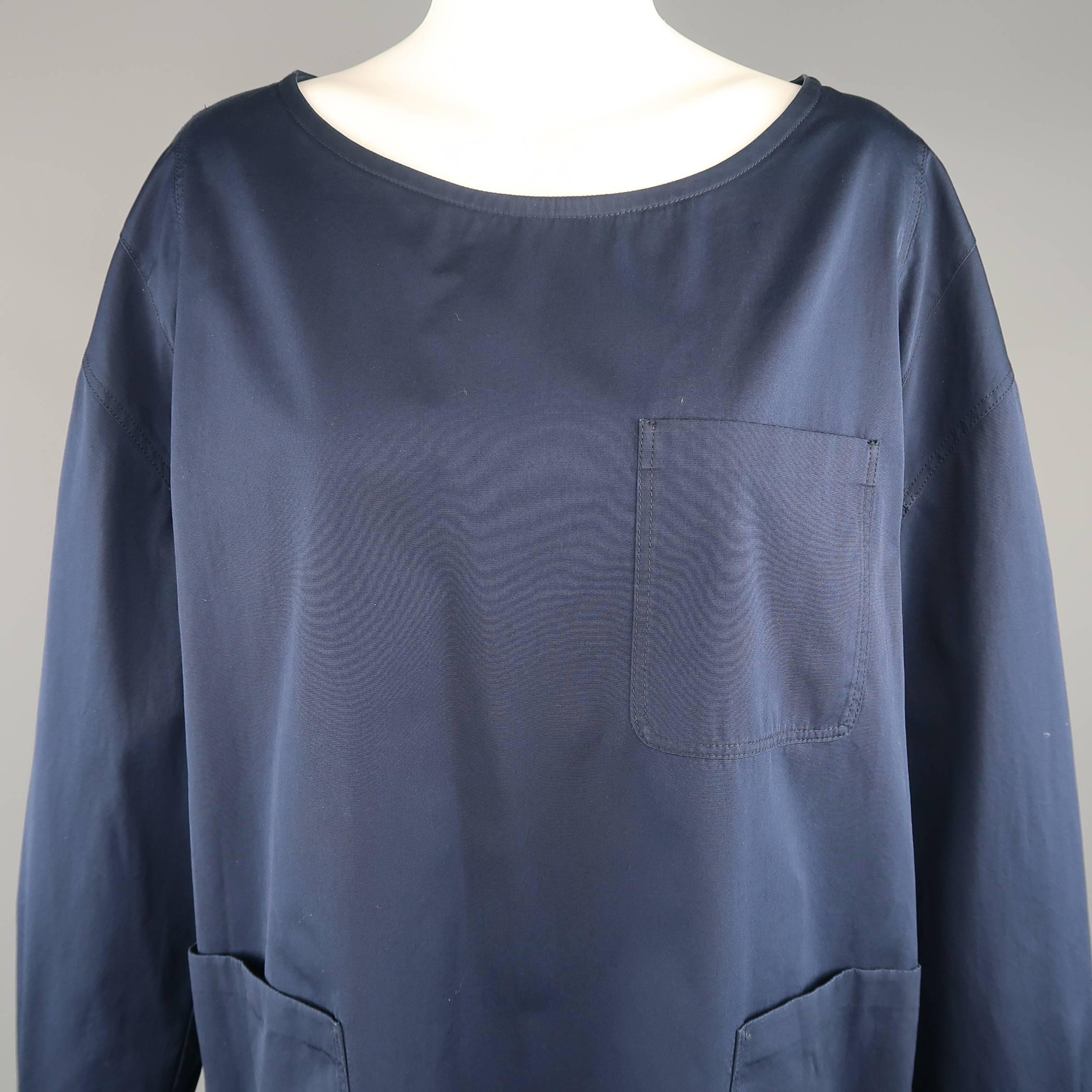 DRIES VAN NOTEN sack dress comes in navy blue cotton with a boat neck, oversized a line silhouette, patch pockets, and drop shoulder lone sleeves with denim jacket button cuffs.
 
Excellent Pre-Owned Condition.
Marked: Small
 
Measurements:
