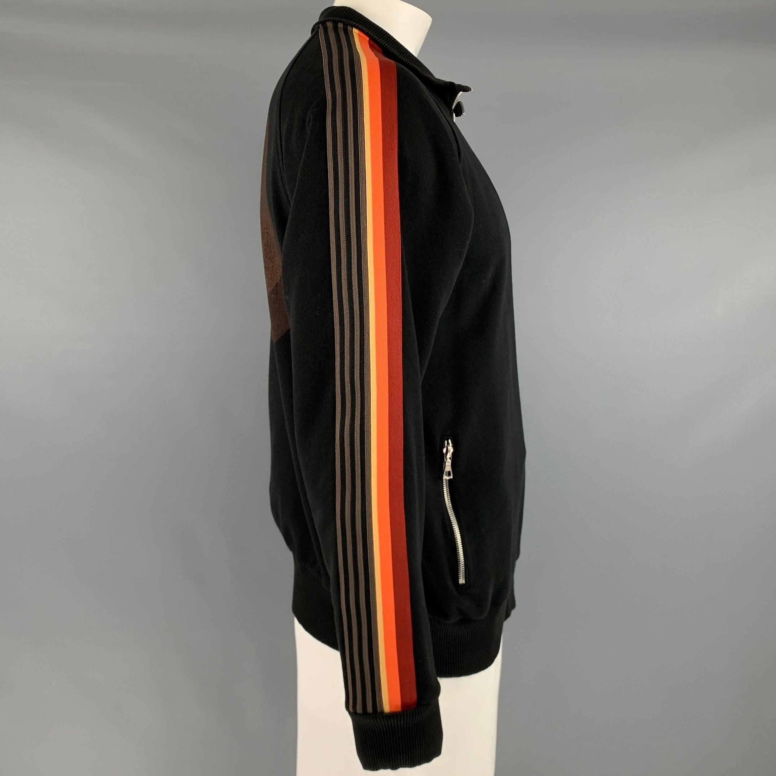 DRIES VAN NOTEN x VERNER PANTON jacket
in a black cotton fabric featuring multi-color stripe details on the shoulder and sleeves, yellow sphere print on the back, and zip up closure. Excellent Pre-Owned Condition. 

Marked:   XL 

Measurements: 
