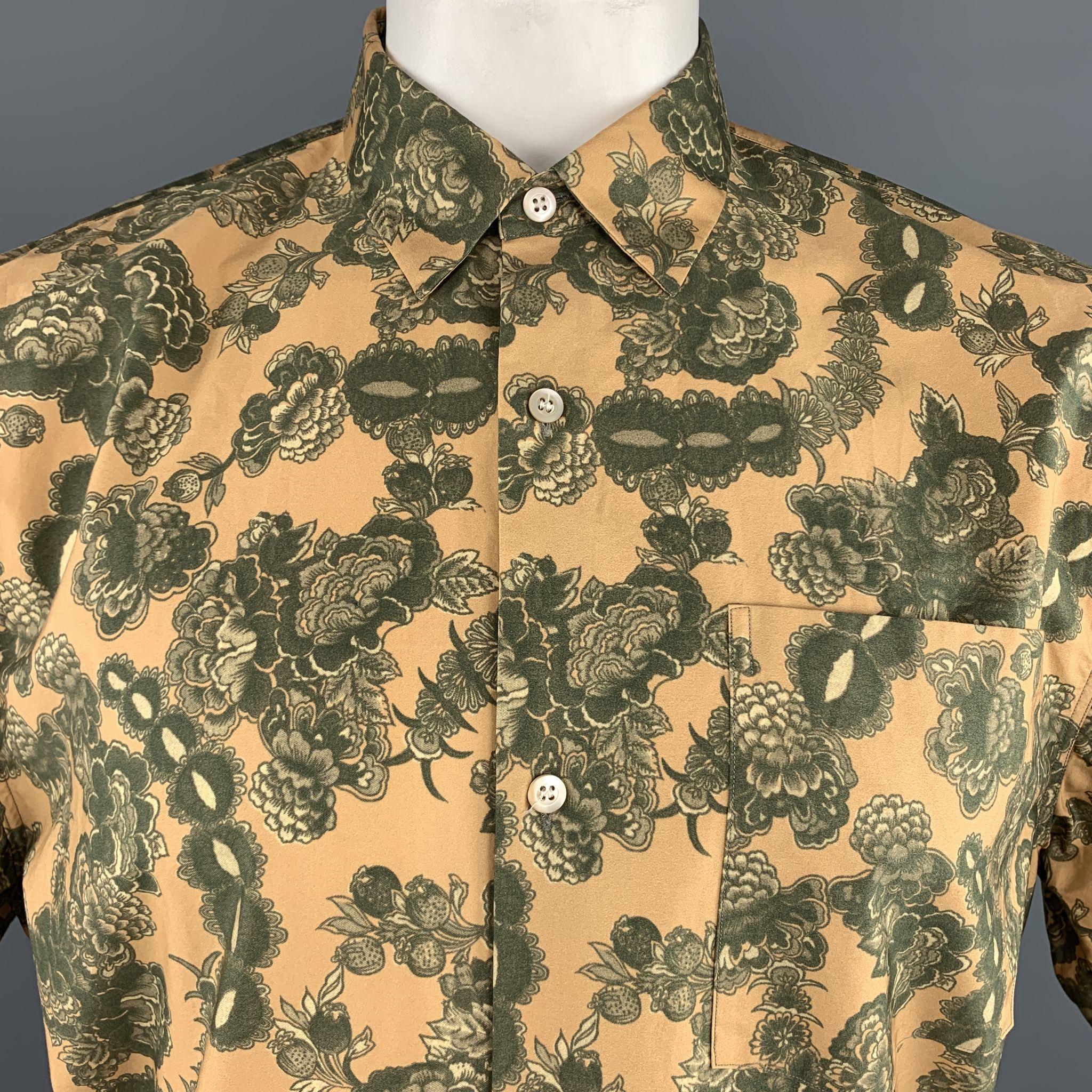 DRIES VAN NOTEN shirt comes in gold and green floral print cotton with a pointed collar, patch breast pocket, short sleeves, and bronze print hem panel. 

Excellent Pre-Owned Condition.
Marked: Extra Large

Measurements:

Shoulder: 21 in.
Chest: 52