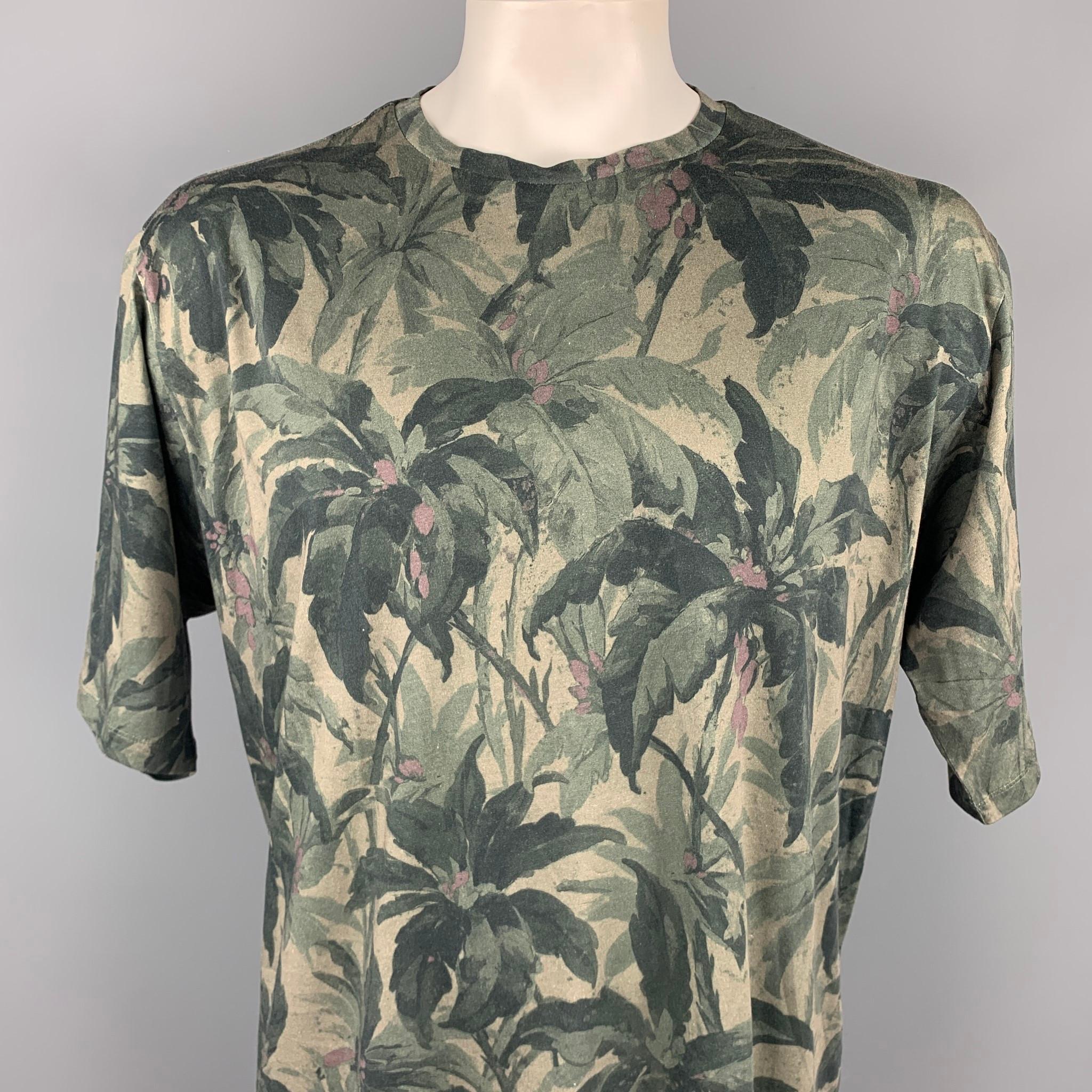 DRIES VAN NOTEN t-shirt comes in a olive print cotton featuring a oversized style and a crew-neck.

Excellent Pre-Owned Condition.
Marked: XL

Measurements:

Shoulder: 22.5 in.
Chest: 50 in. 
Sleeve: 12.5 in. 
Length: 30 in. 
