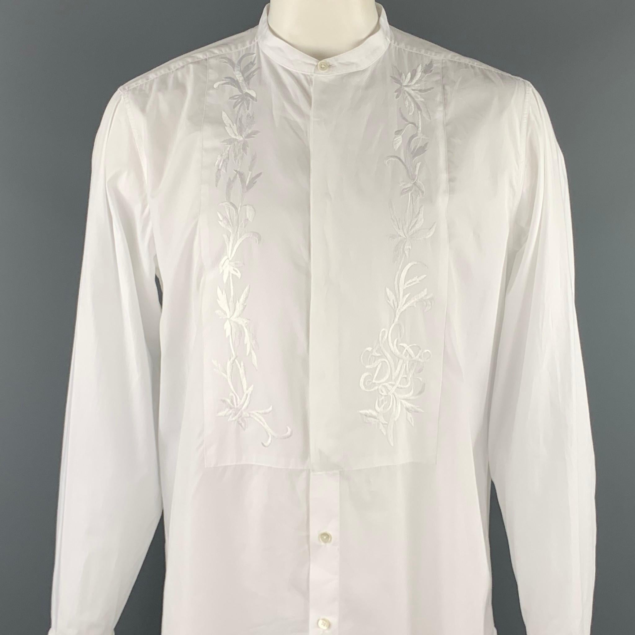 DRIES VAN NOTEN long sleeve shirt comes in a white cotton with front embroidered details featuring a button up style, french cuffs, and a nehru collar. Cufflinks not included. 

Excellent Pre-Owned Condition.
Marked: 54

Measurements:

Shoulder: 19