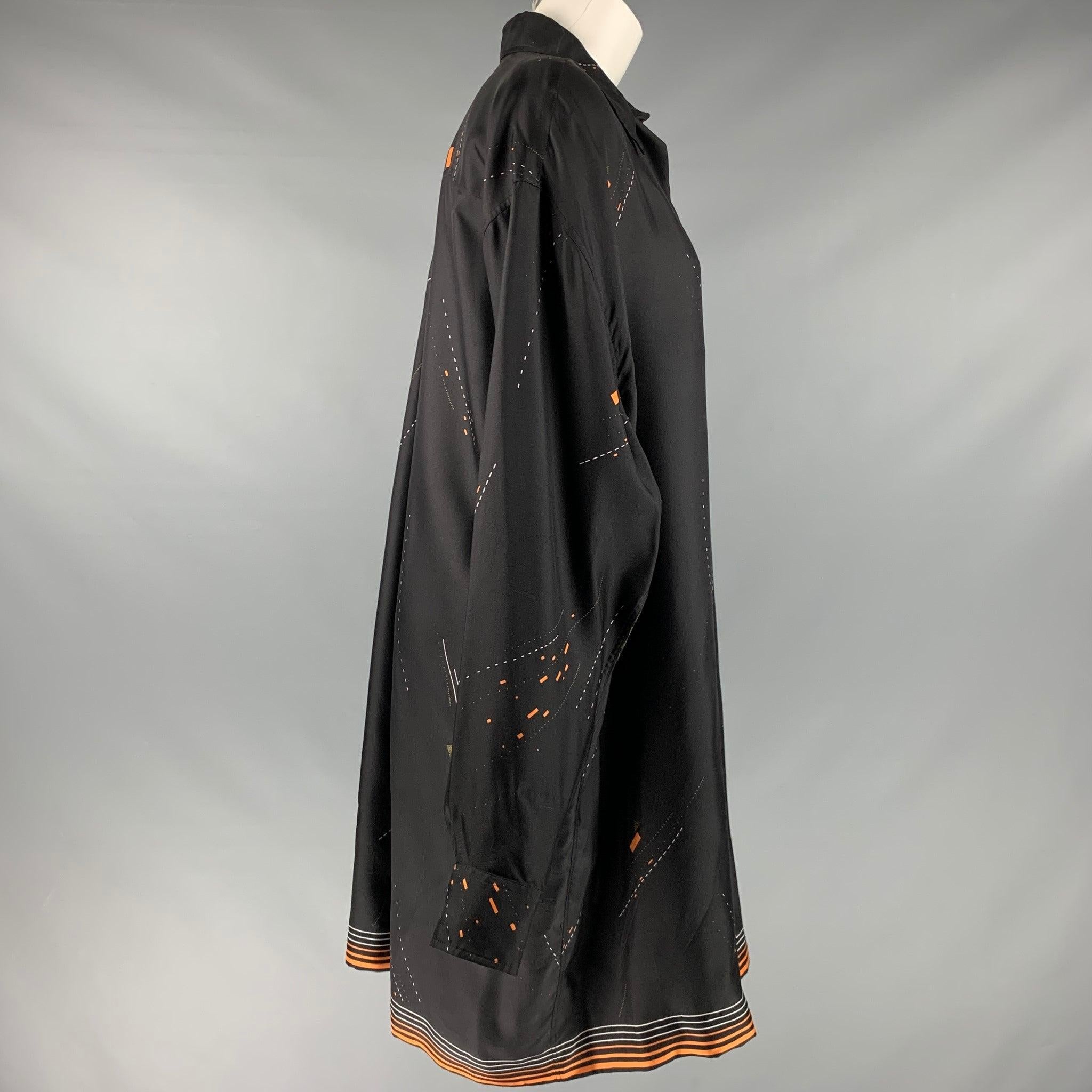 DRIES VAN NOTEN shirt
in a black, orange, and white silk fabric featuring a tunic style, long and loose fit, abstract print, one pocket, and a button closure.Very Good Pre-Owned Condition. Minor signs of wear. 

Marked:   XS 

Measurements: 
