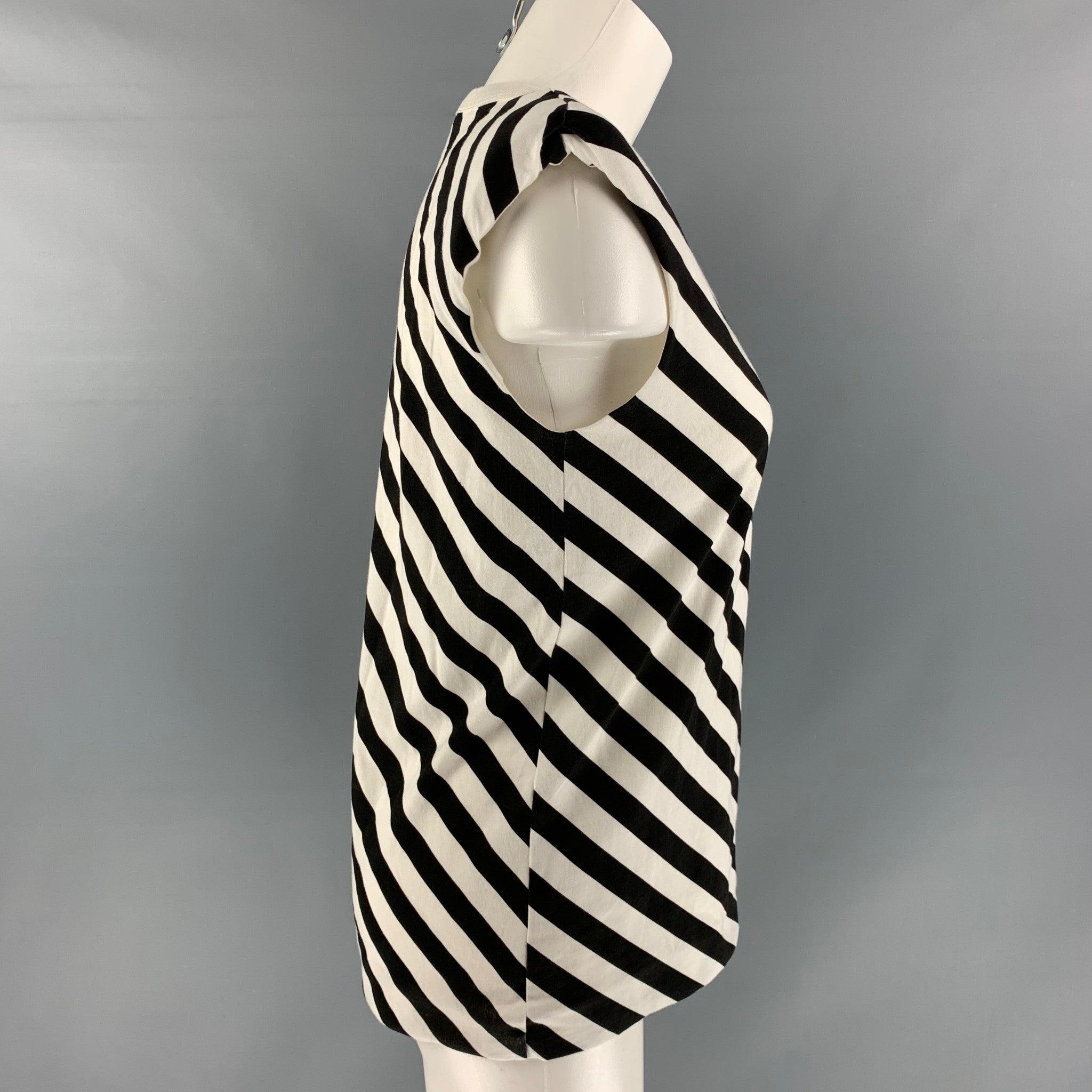 DRIES VAN Noten casual top comes in black and white stripped cotton jersey featuring shoulder pads and crew- neck.
 Excellent Pre-Owned Condition. 

Marked:   XS 

Measurements: 
 
Shoulder: 16 inches 
Bust: 36 inches 
Length: 24 inches  

  
  
