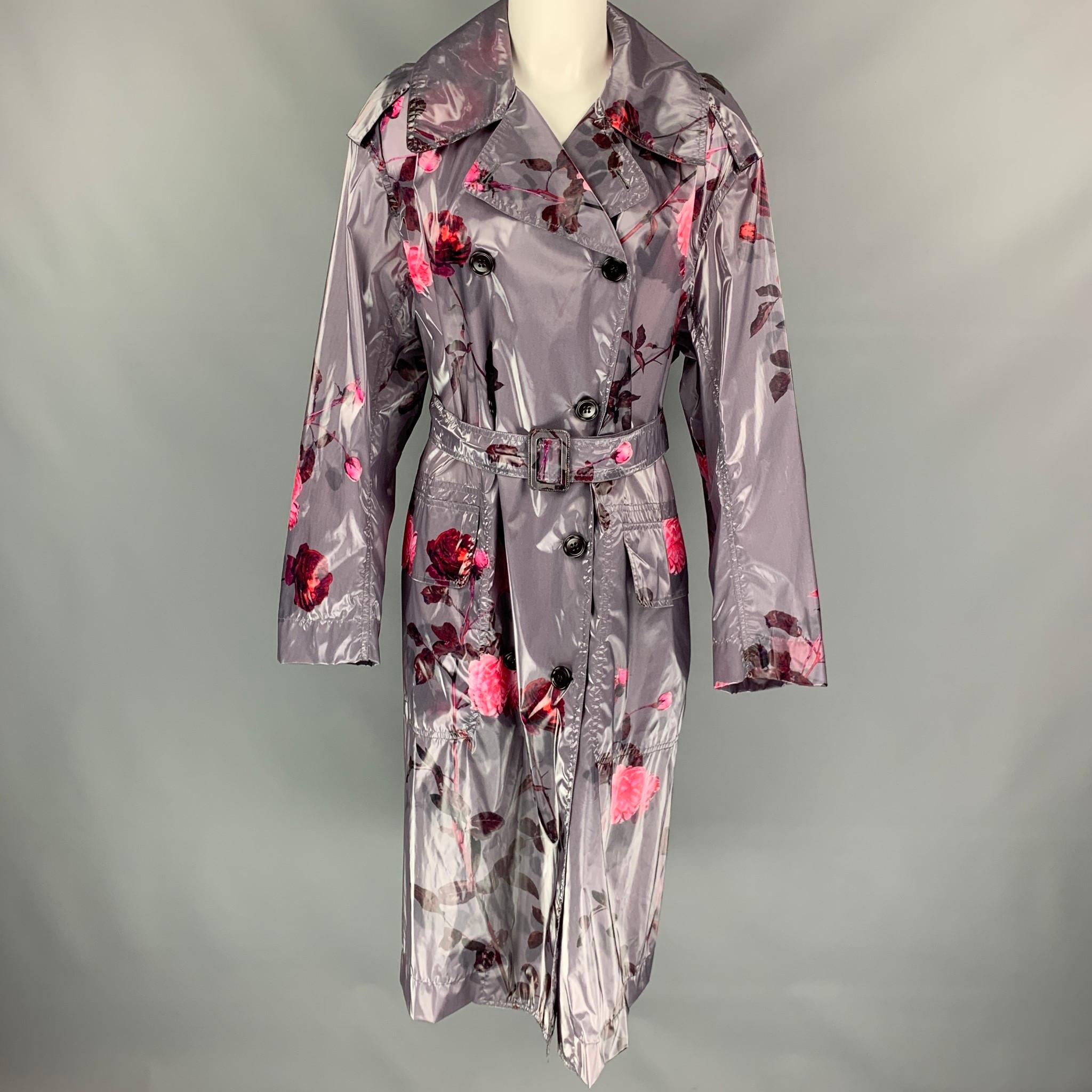 DRIES VAN NOTEN trench coat comes in a grey & pink floral polyurethane blend featuring a belted style, oversized fit, flap pockets, and a double breasted closure. Made in Poland. 

New With Tags. 
Marked: XS
Original Retail Price: