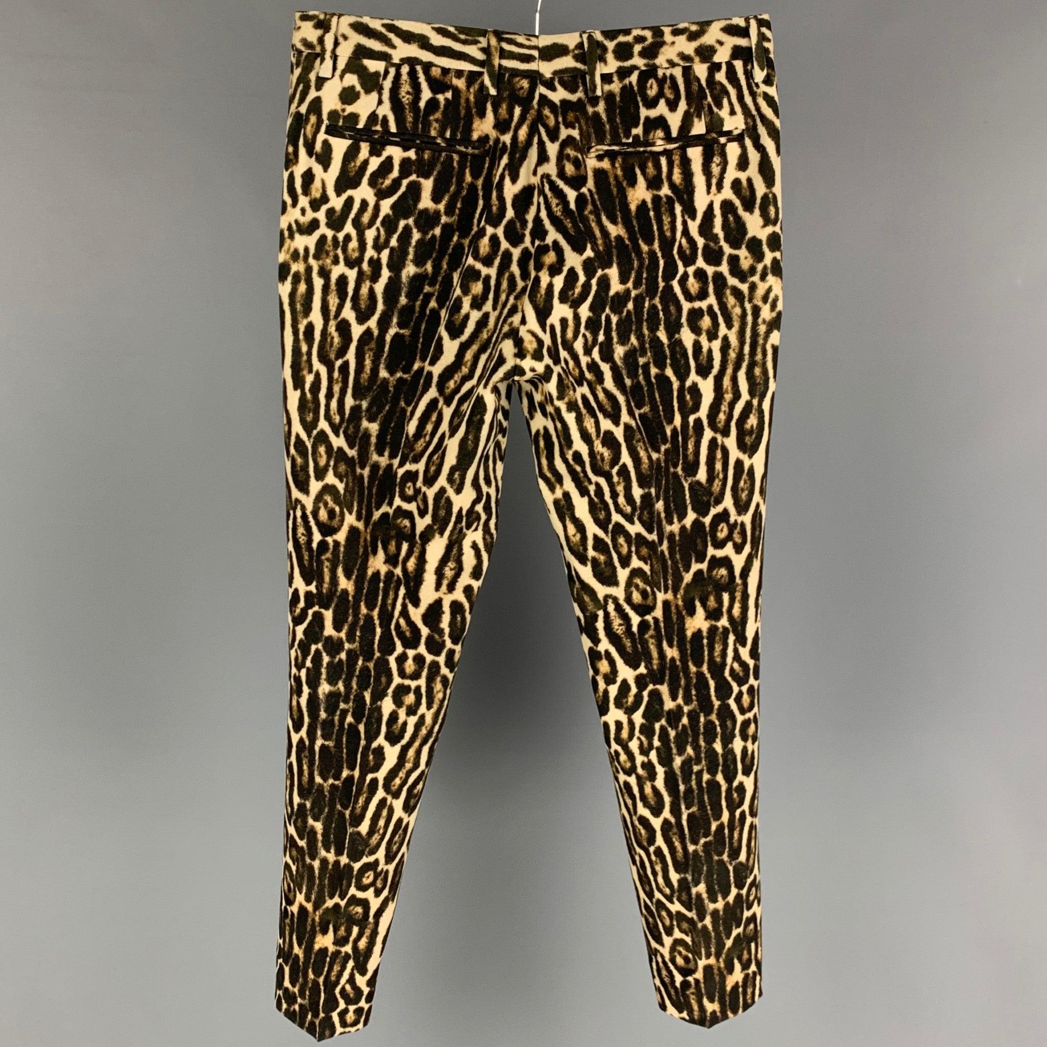 DRIES VAN NOTEN Spring-Summer 2020 dress pants comes in a black & tan animal print wool featuring a flat front, front tab, and a zip fly closure.
Excellent
Pre-Owned Condition. 

Marked:   46 

Measurements: 
  Waist: 31 inches  Rise: 9 inches 
