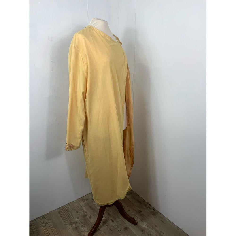 Dries Van Noten Synthetic Top in Yellow

Caftan Dries Van Noten. 
Missing composition label. 
Beautiful floral embroidery. 
Medium size. Fits multiple sizes. 
Measures 50cm shoulders, 65cm bust, 120cm long and 60cm sleeve. 
Excellent condition,