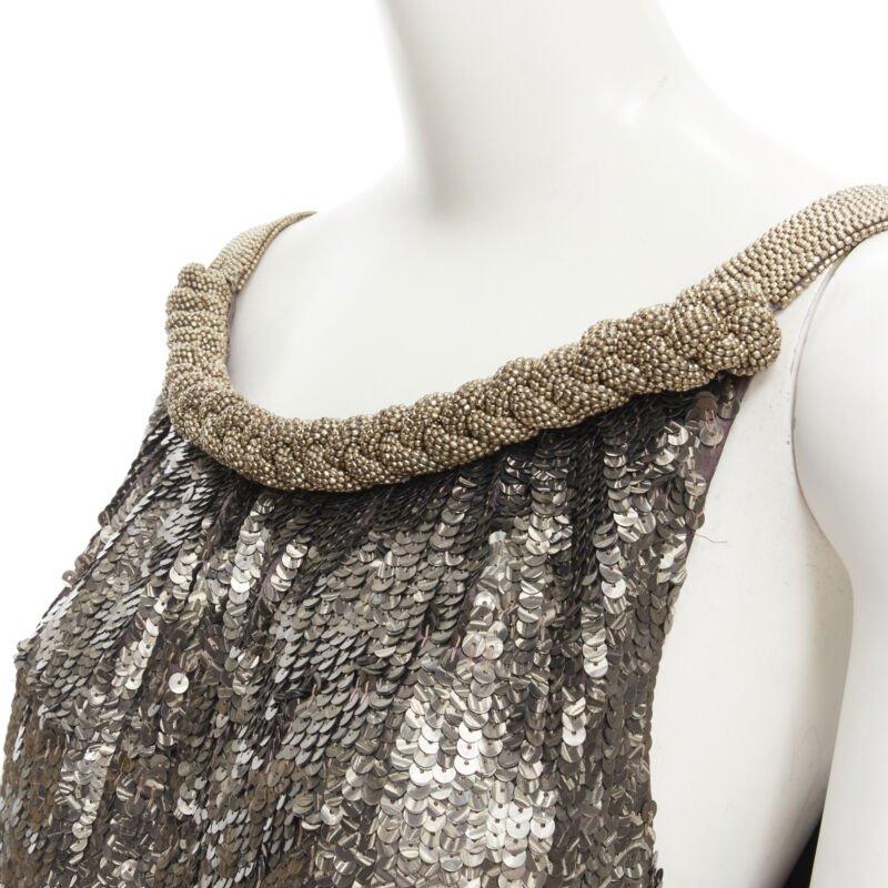 DRIES VAN NOTEN Vintage silver beaded braid neckline silver sequins dress FR40 M
Reference: GIYG/A00148
Brand: Dries Van Noten
Material: Silk
Color: Silver
Pattern: Solid
Lining:  Silk
Extra Details: Silver beaded braid trim neckline. Silver