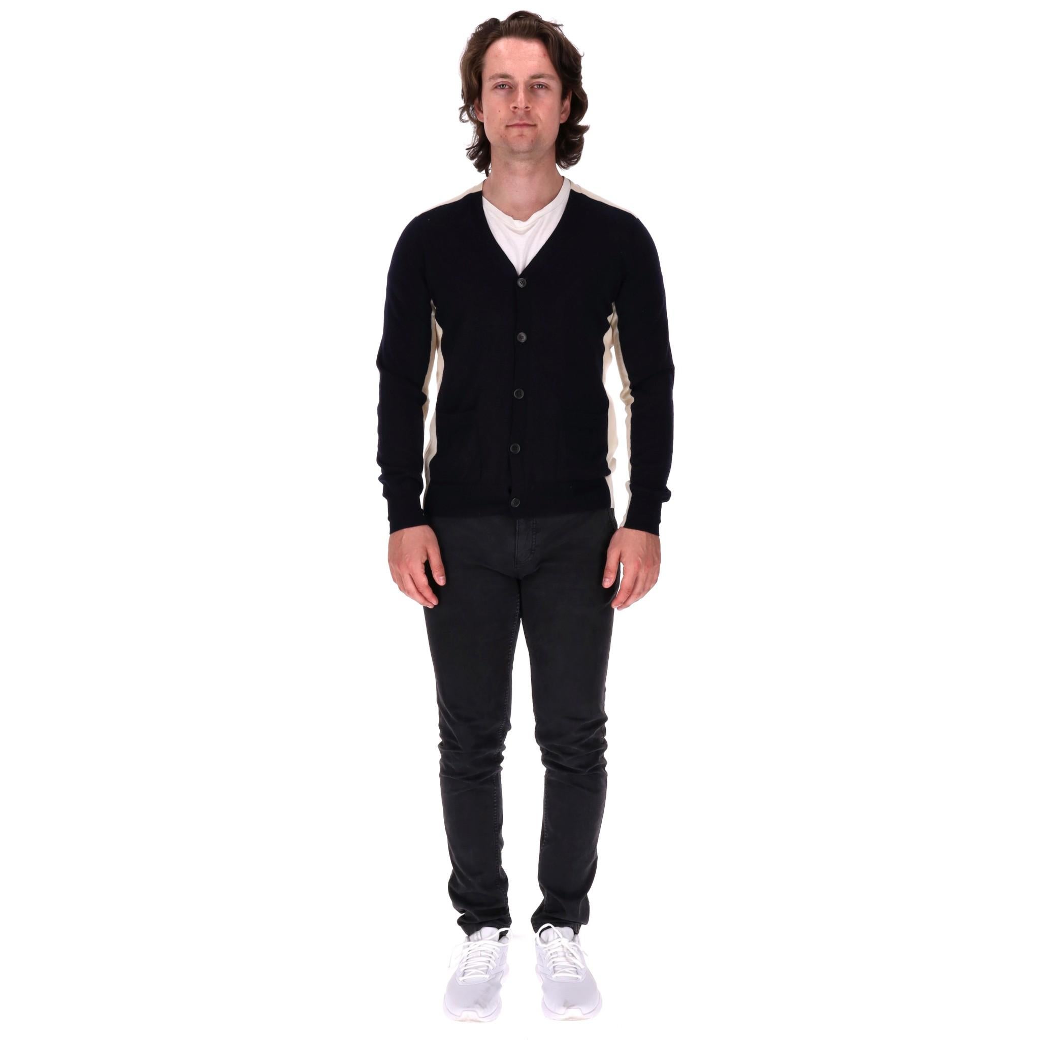 Dries Van Noten Wool Cardigan

Navy fitted cardigan designed with ivory inserts to the sides and sleeves.

Featuring centre button closure, flap pockets to the front and V-Neck.

Rrp Approx. £650

Size – L

Condition – Very Good

Composition – 100%